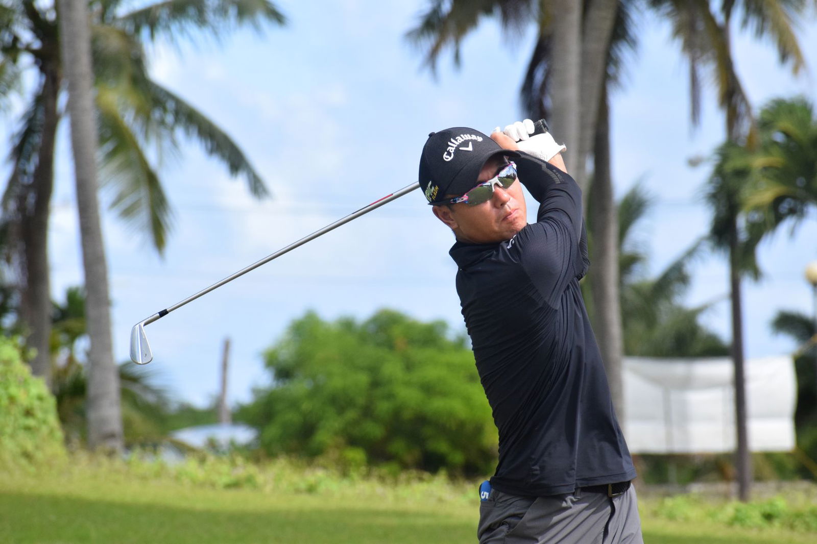 Championship Flight player Jin Feng Chun tees off.