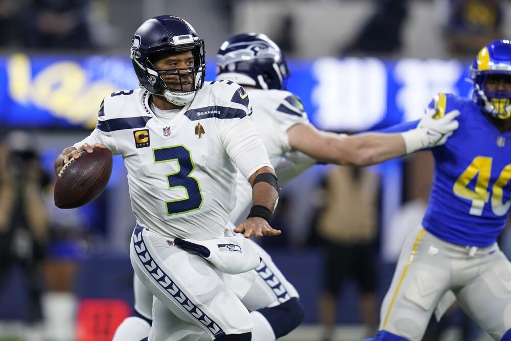 Seattle Seahawks quarterback Russell Wilson looks to throw during the first half of the team's NFL football game against the Los Angeles Rams on Tuesday in Inglewood, Calif.