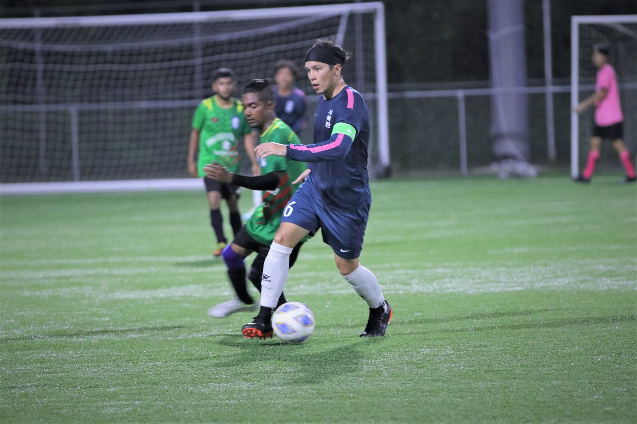 The One FC's Don Cabrera dribbles past a defender during a Hafa Adai Fun Cup game Friday at the NMI Soccer Training Center.