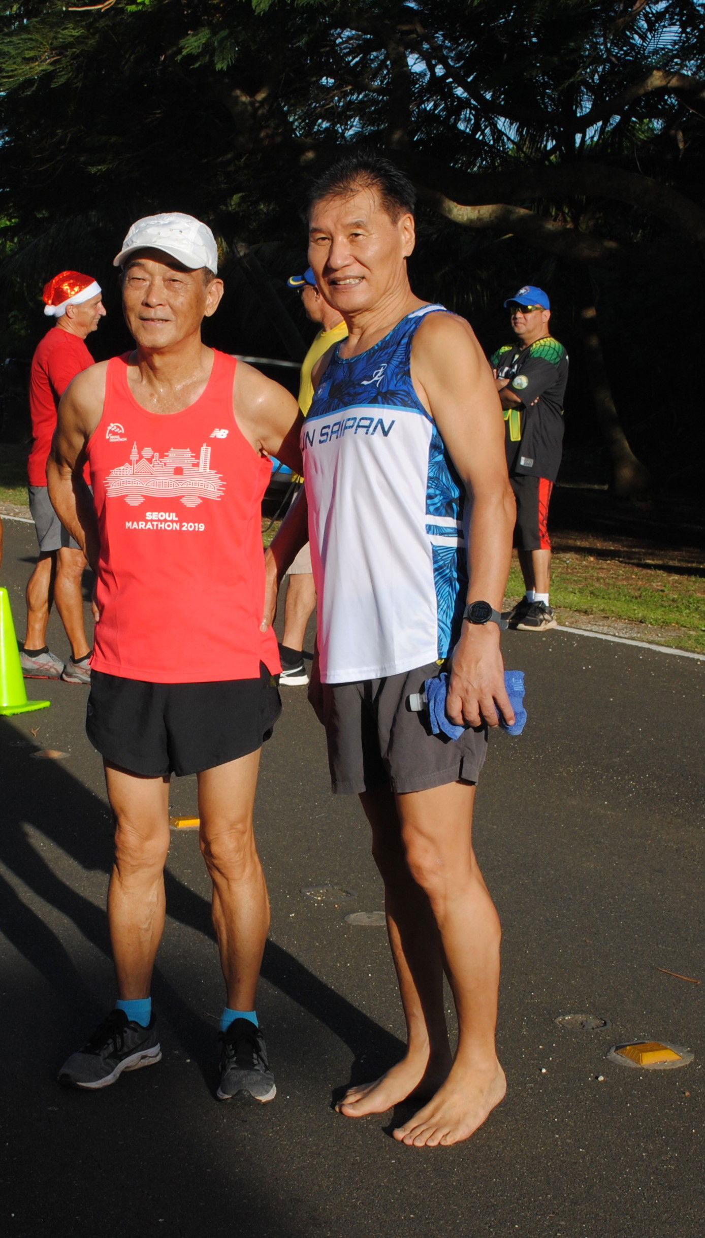 Chang and Chong Nam Lee pose for a photo after completing the 40th Annual Christmas Island Relay Saturday at the Last Command Post in Marpi.