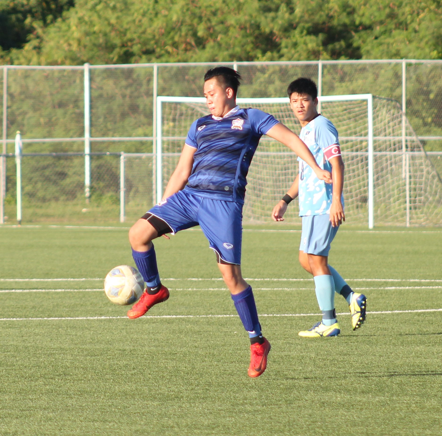 Eleven Tiger's Saixian Bagsic leaps to intercept the ball during a Marianas Soccer League semifinal game Sunday at the NMI Soccer Training Center.