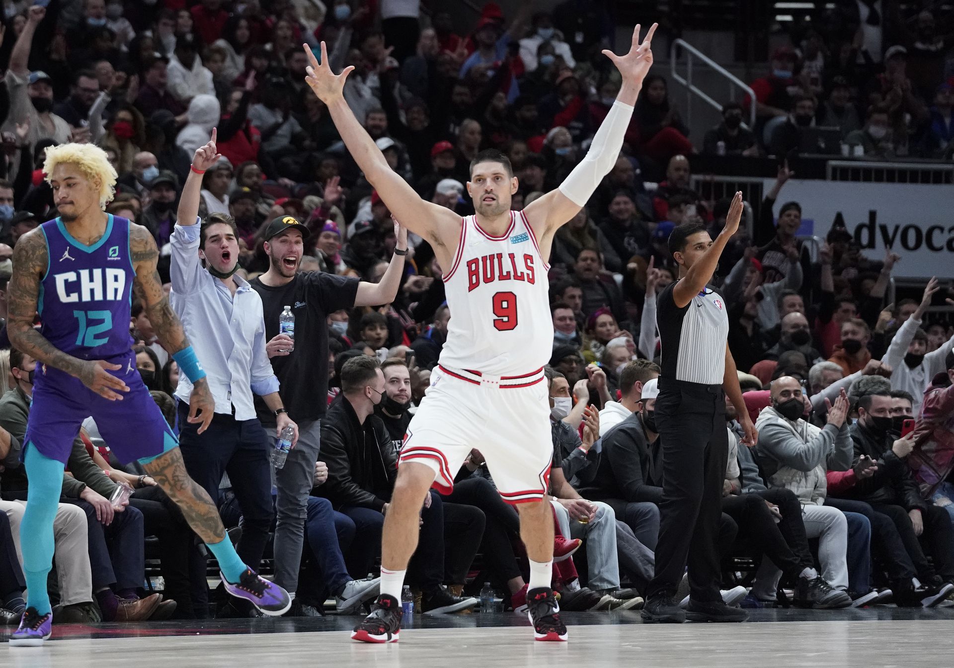 Chicago Bulls center Nikola Vucevic (9) gestures after making a three point basket against the Charlotte Hornets during the second half at United Center in Chicago, Illinois on Nov. 29, 2021.