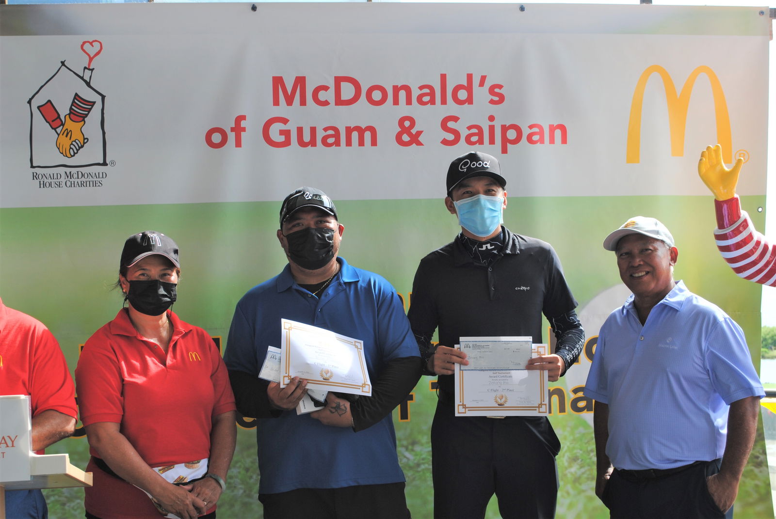 McDonald's Saipan & Guam co-owner Marcia Ayuyu with Lester Manglona, Zekang Ma and McDonald's Saipan & Guam president and co-owner Joe Ayuyu Sr. during the awards ceremony at Laolao Bay Golf & Resort on Saturday..