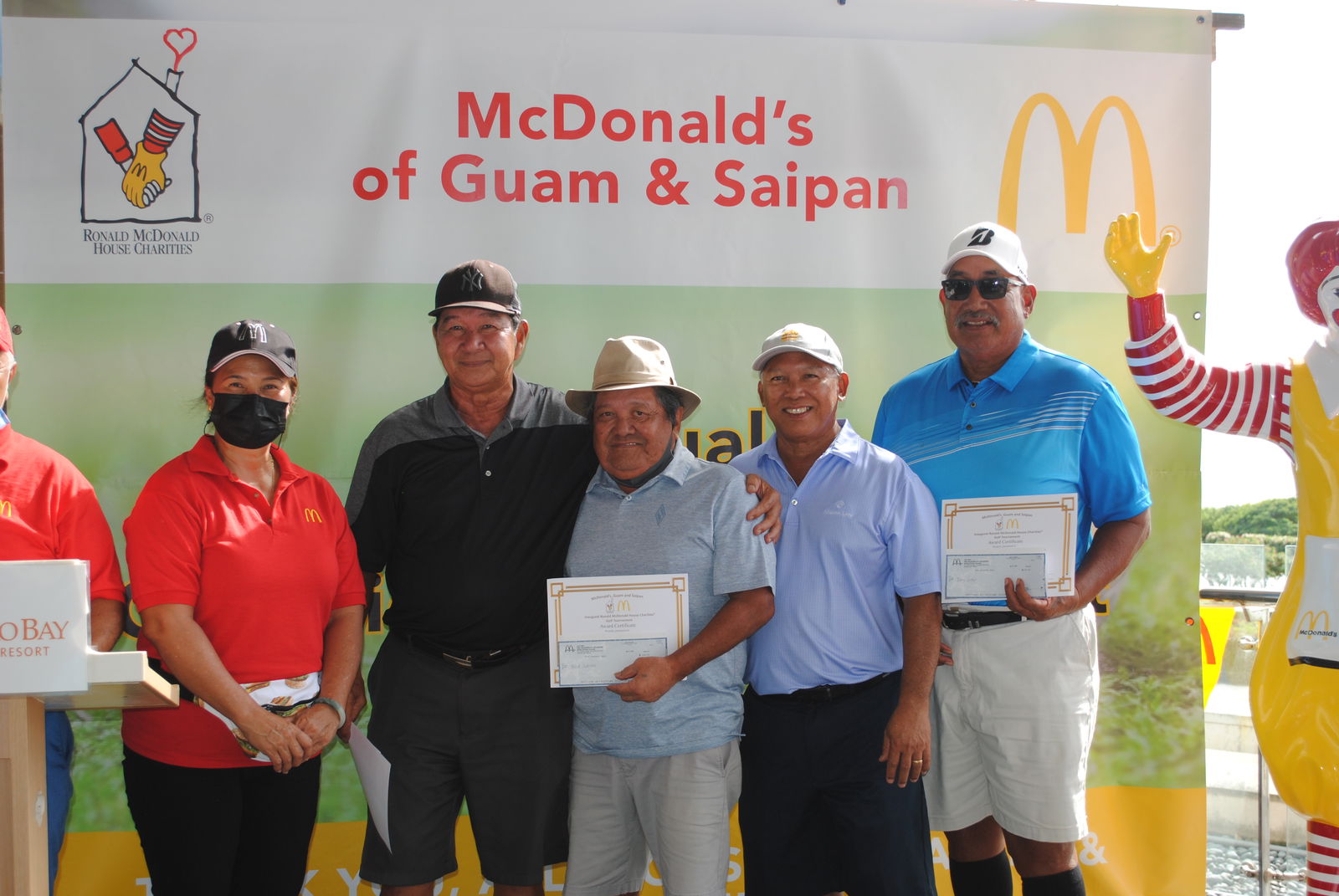 McDonald's Saipan & Guam co-owner Marcia Ayuyu with Benjamin Jones, Nick Sablan, McDonald's Saipan & Guam president and co-owner Joe Ayuyu Sr. and Tony Satur during the awards ceremony at Laolao Bay Golf & Resort on Saturday.