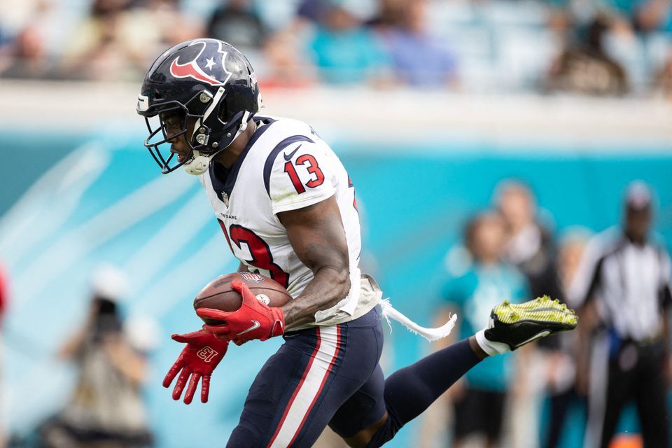 Houston Texans wide receiver Brandin Cooks (13) runs with the ball for a touchdown during the first half against the Jacksonville Jaguars at TIAA Bank Field in Jacksonville, Florida on Dec. 19, 2021.