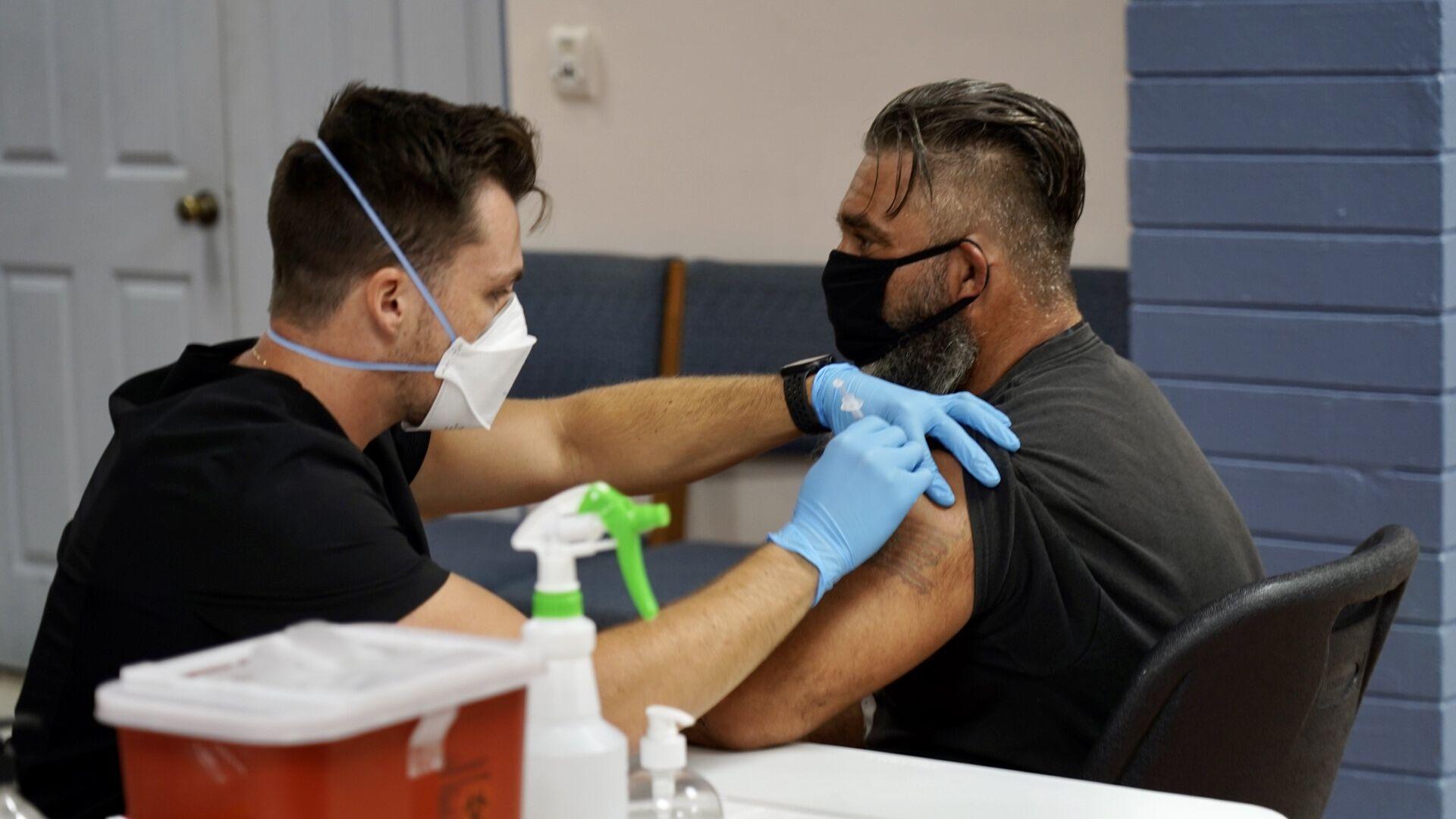 Jason Flory of Barrigada and his wife Jennifer Flory, not pictured, got their vaccine shots at the Barrigada mayor's office on Thursday.