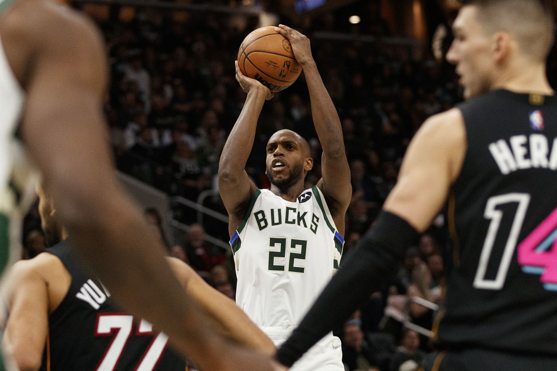Milwaukee Bucks forward Khris Middleton (22) shoots the ball against the Miami Heat during the fourth quarter at Fiserv Forum in Milwaukee, Wisconsin on Dec. 4, 2021.