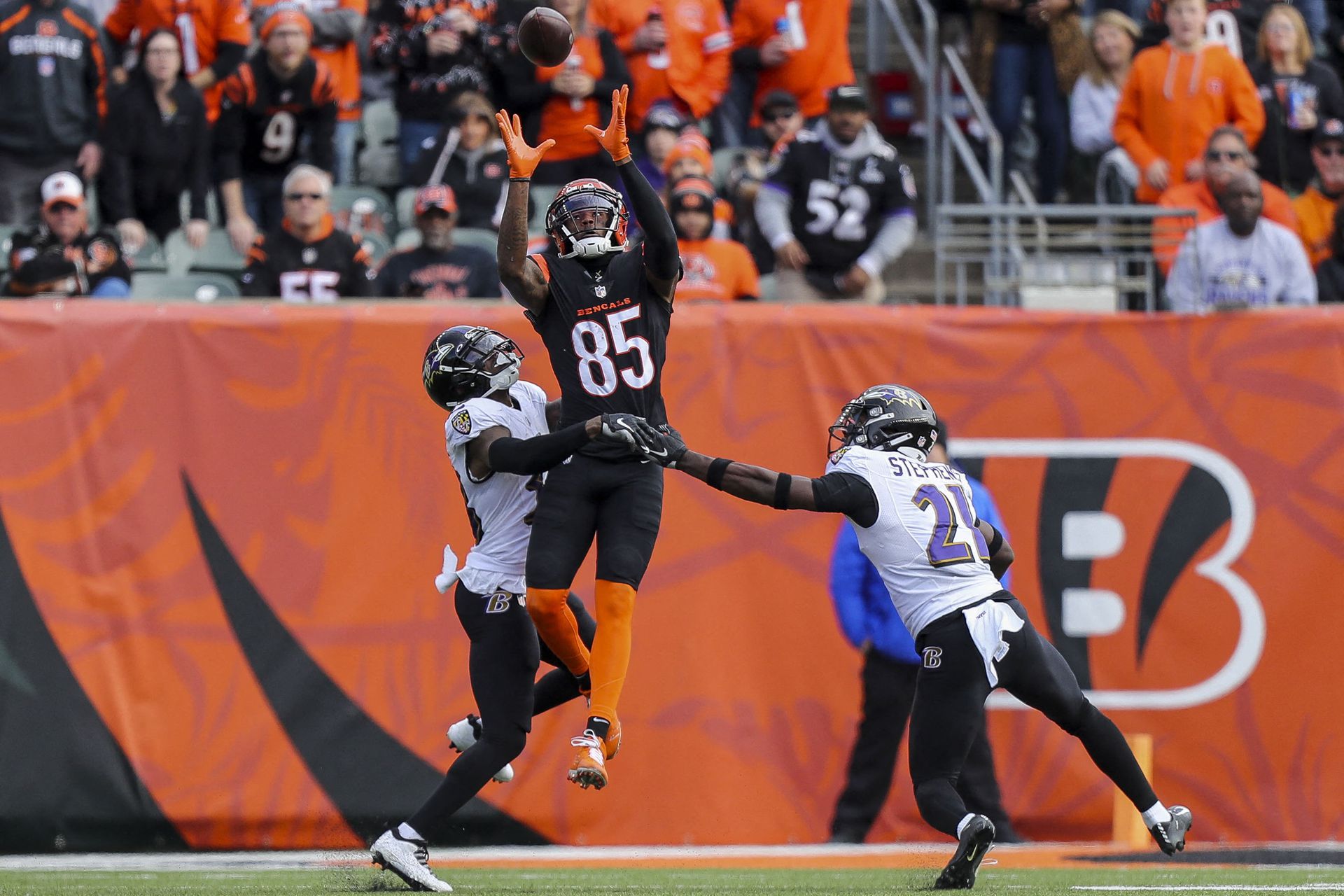 Cincinnati Bengals wide receiver Tee Higgins (85) catches a pass against Baltimore Ravens defensive back Kevon Seymour (38) and safety Brandon Stephens (21) in the first half at Paul Brown Stadium in Cincinnati, Ohio on Dec. 26, 2021.