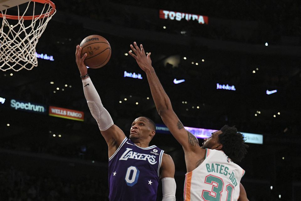 San Antonio Spurs forward Keita Bates-Diop (31) defends against Los Angeles Lakers guard Russell Westbrook (0) during the third quarter at Staples Center in Los Angeles, California on Dec 23, 2021.