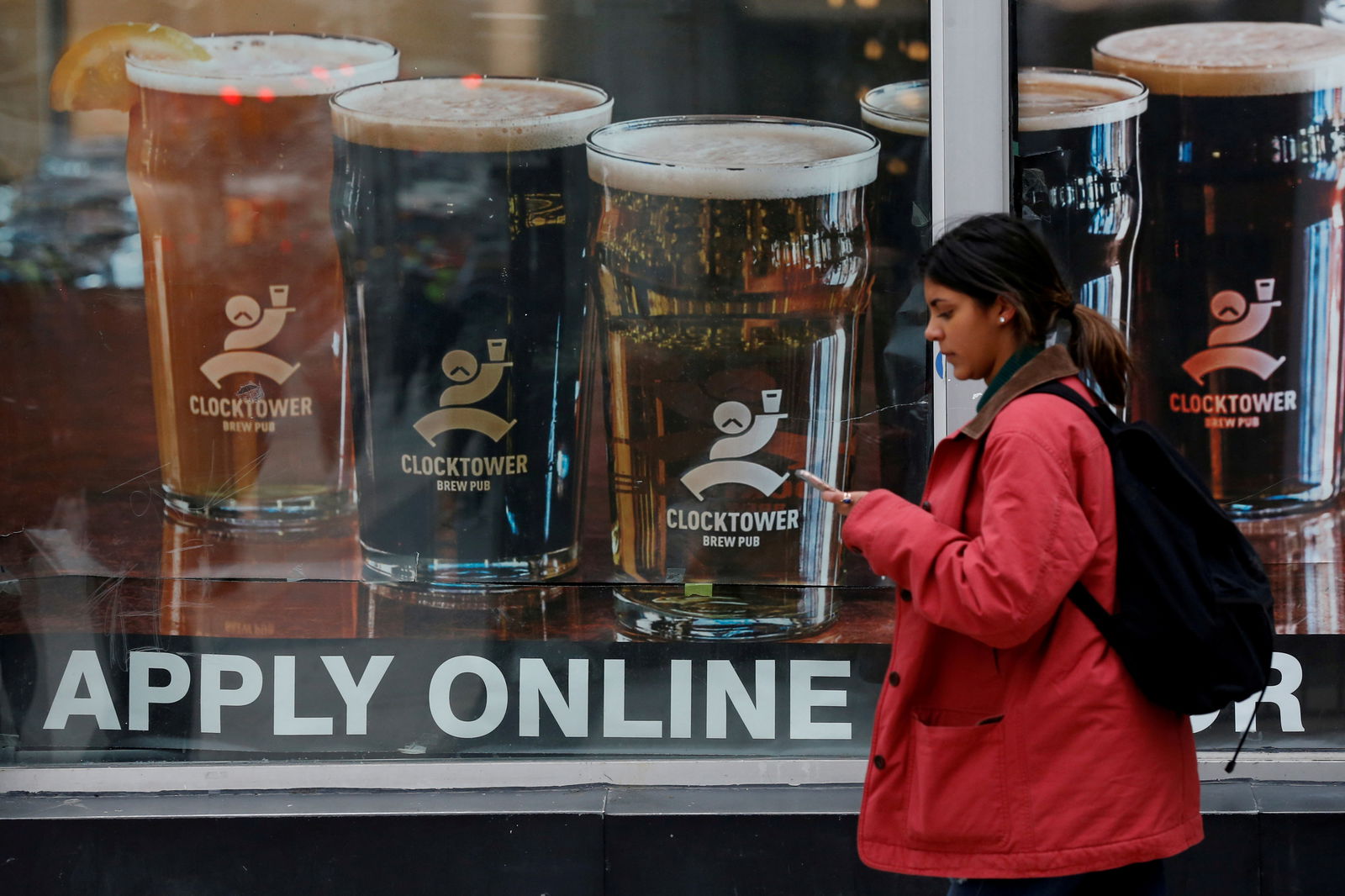 A sign advertising available jobs at the Clocktower Brew Pub hangs in a window in Ottawa, Ontario, Canada, Nov. 9, 2017.