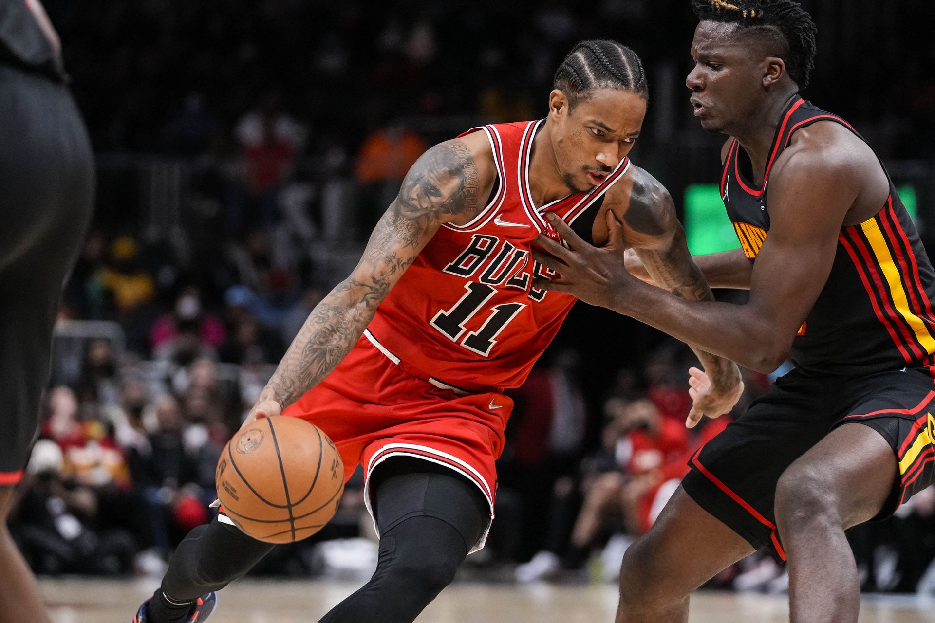 Chicago Bulls forward DeMar DeRozan (11) dribbles against Atlanta Hawks center Clint Capela (15) during the second half at State Farm Arena in Atlanta, Georgia on Dec. 27, 2021.