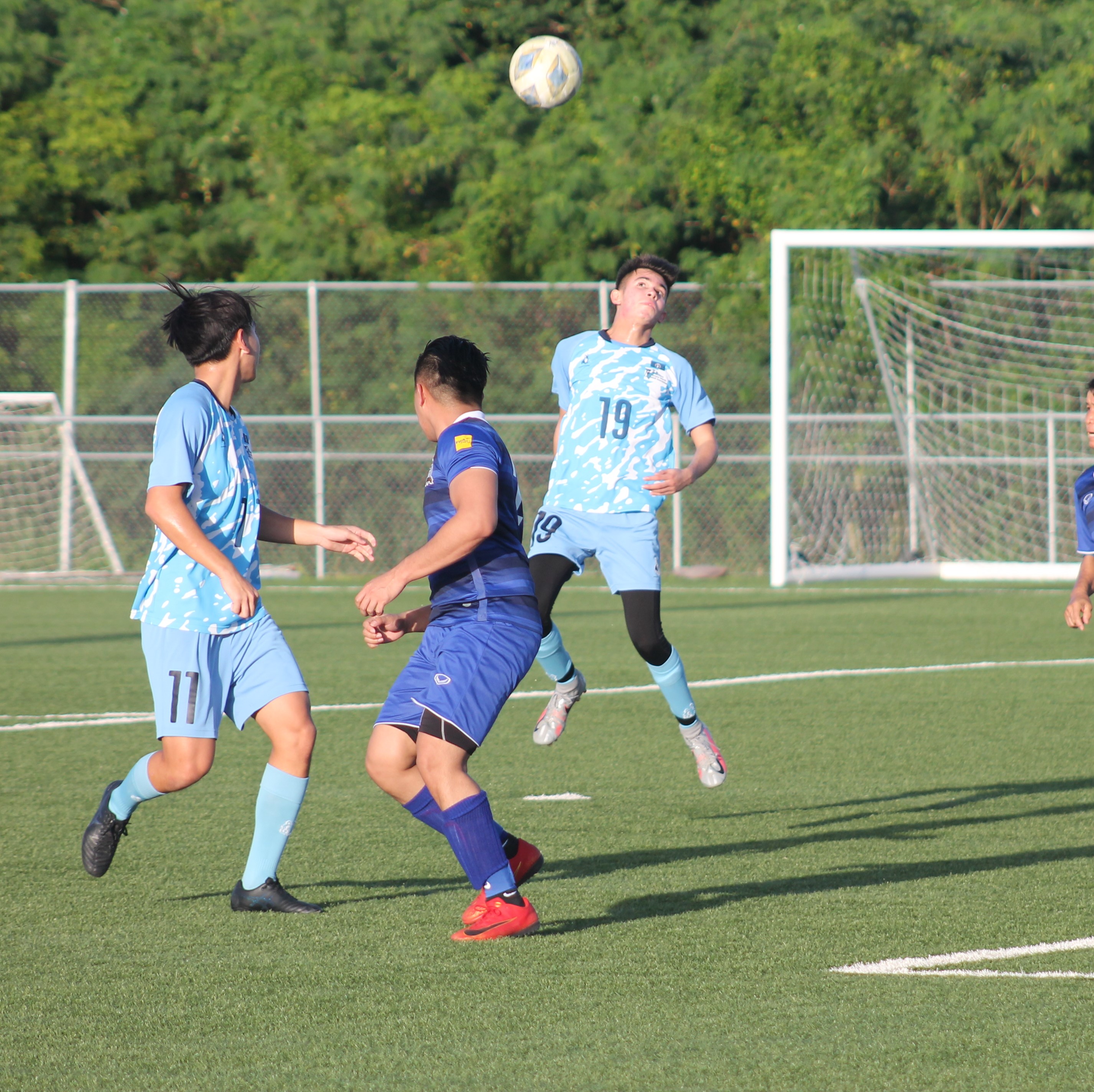 NMI U18 NT's Richard Steele connects the header for an interception.