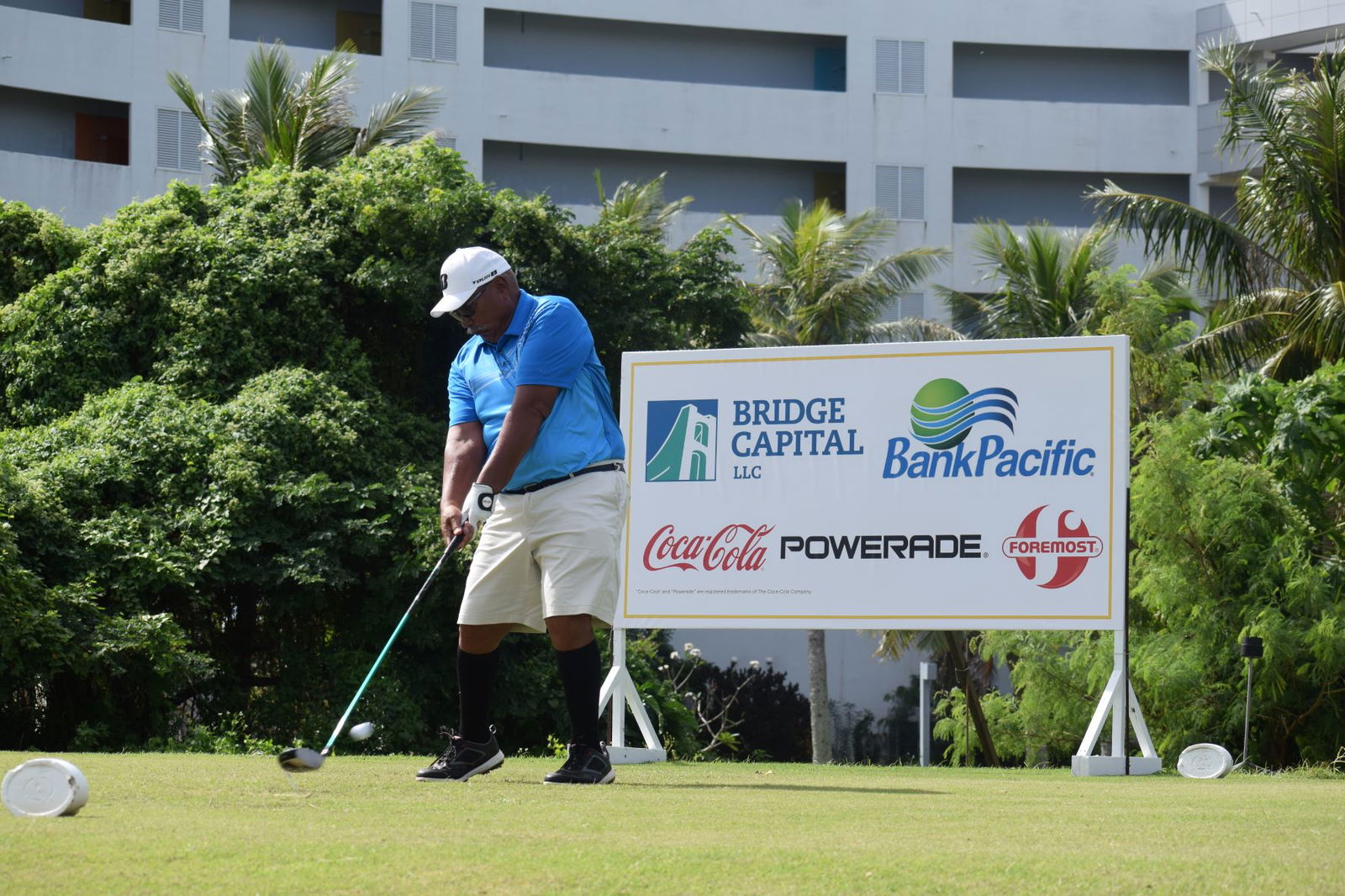 Senior Flight Tony Satur hits the ball as he drives from the Hole No. 10 tee box.