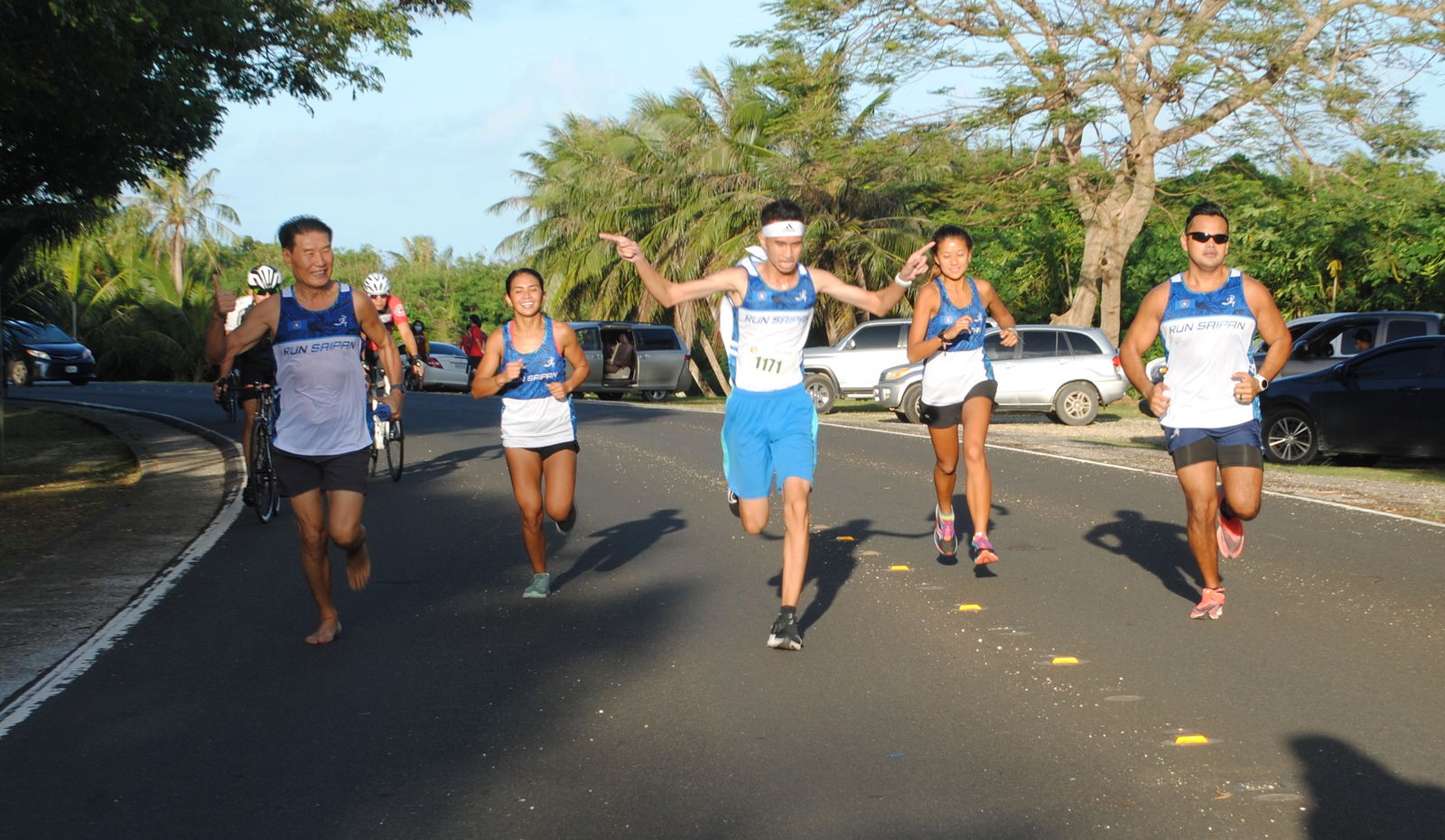 Run Saipan Team B members celebrate as they cross the finish line.