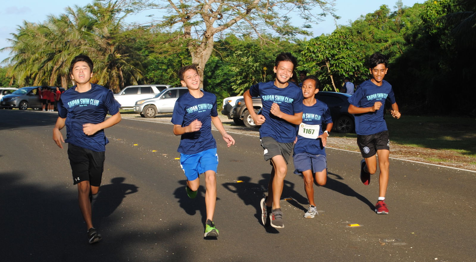 The Saipan Swim Club runners head to the finish line.