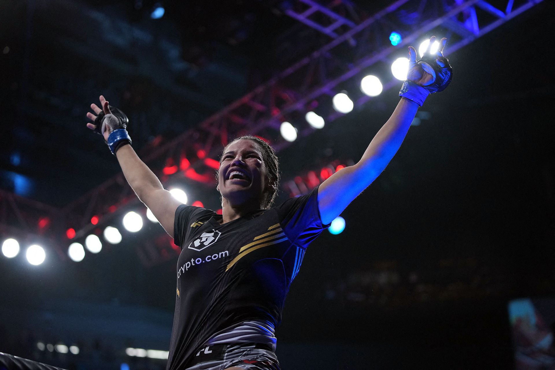 Julianna Pena celebrates her victory by submission against Amanda Nunes during UFC 269 at T-Mobile Arena in Las Vegas, Nevada on Dec. 11, 2021.