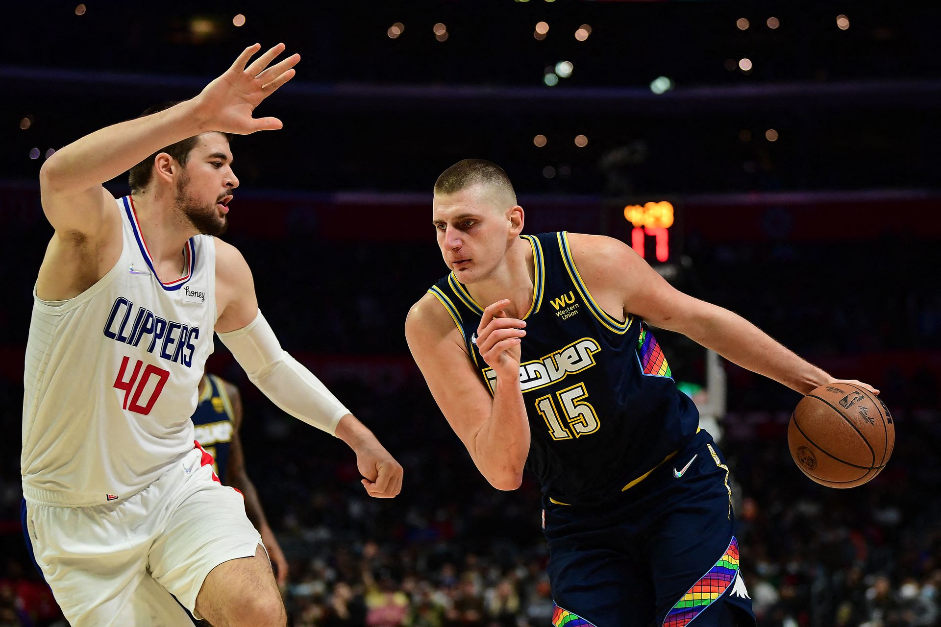 Denver Nuggets center Nikola Jokic (15) moves to the basket against Los Angeles Clippers center Ivica Zubac (40) during the second half at Crypto.com Arena in Los Angeles, California on Dec. 26, 2021.