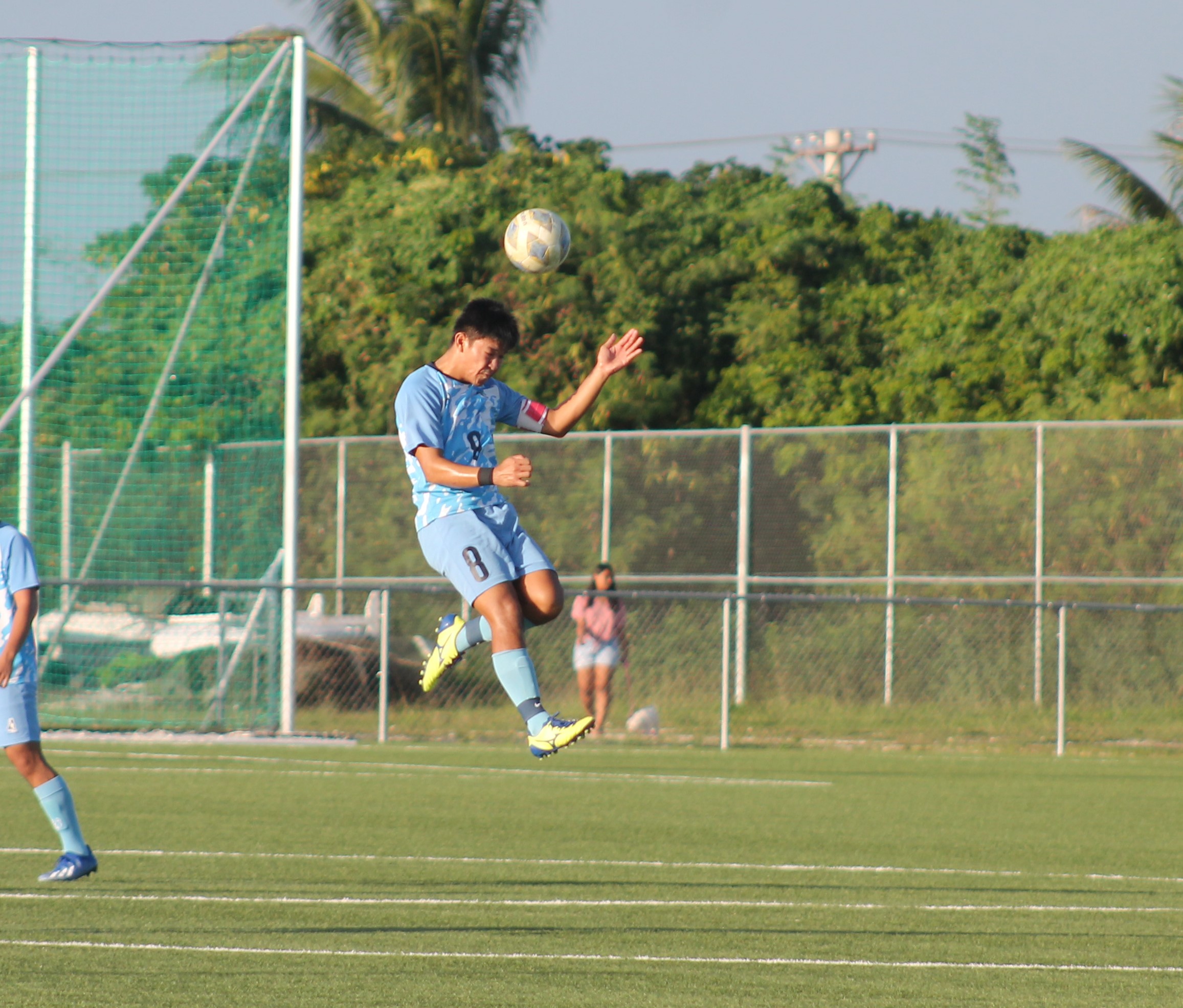 Taka Borja leaps high for the header.
