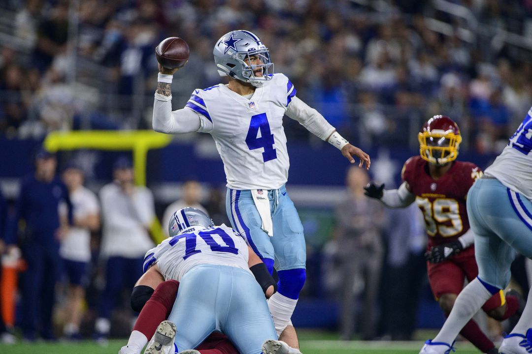 Dallas Cowboys quarterback Dak Prescott (4) in action during the game between the Washington Football Team and the Dallas Cowboys at AT&T Stadium in Arlington, Texas on Dec. 26, 2021.