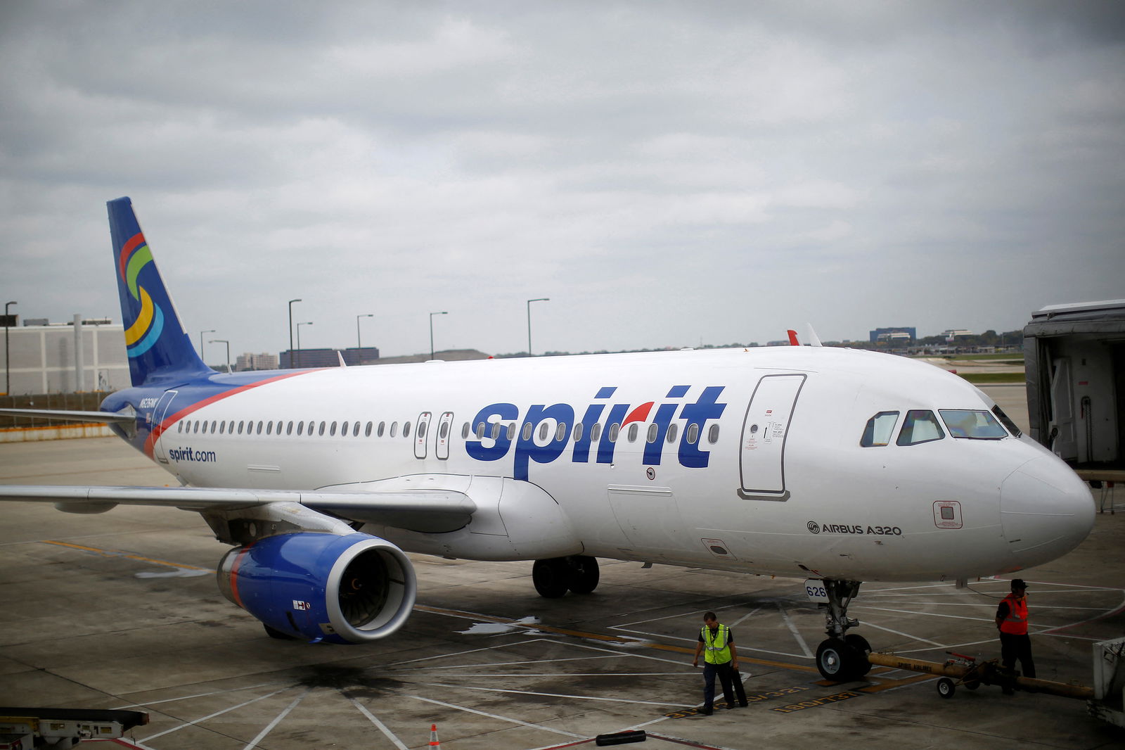 A Spirit Airlines Airbuys A320-200 airplane sits at a gate at the O'Hare Airport in Chicago, Illinois on Oct. 2, 2014.