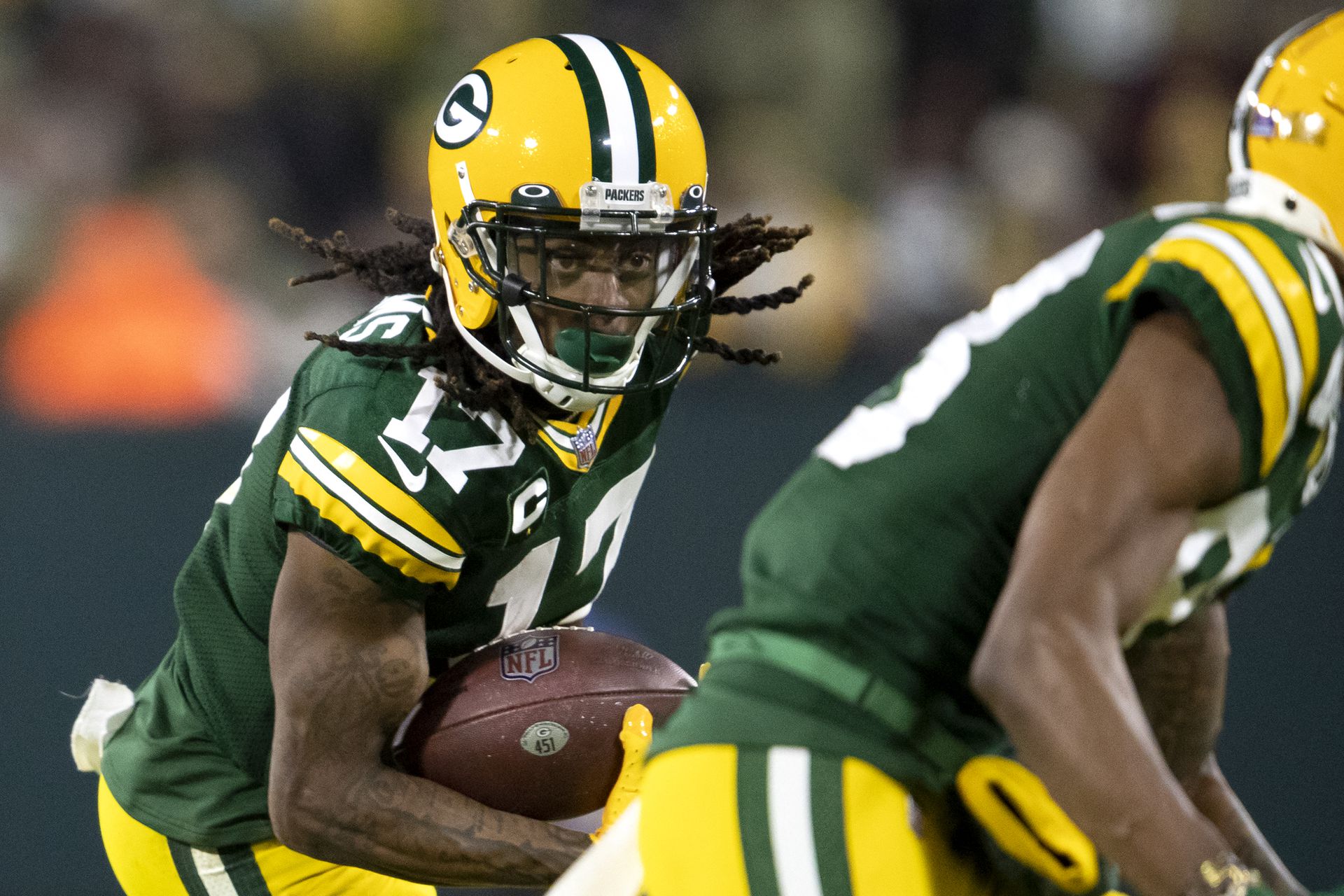 Green Bay Packers wide receiver Davante Adams (17) runs with the ball in the second quarter against the Minnesota Vikings at Lambeau Field  in Green Bay, Wisconsin on Jan. 2, 2022.