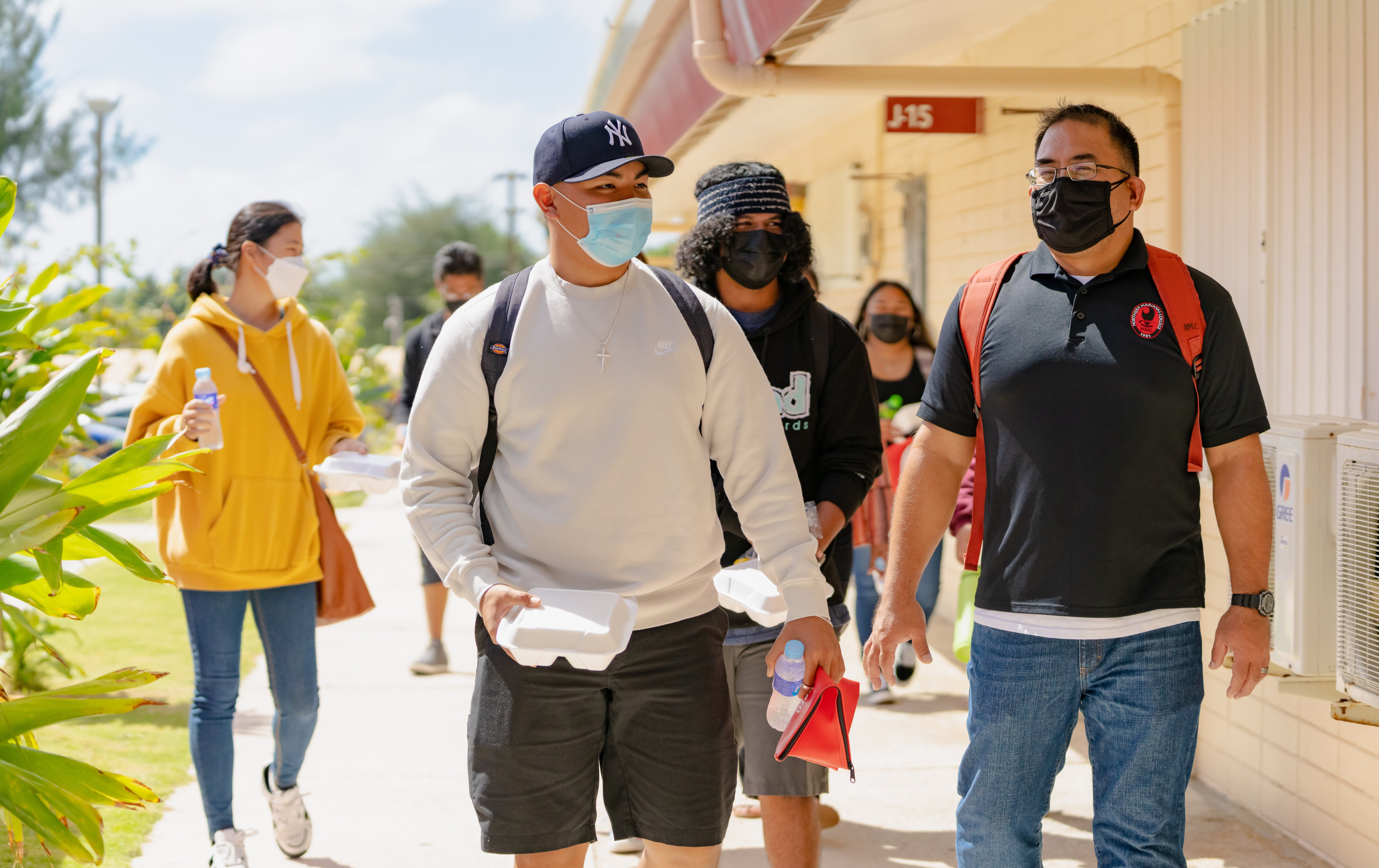 Northern Marianas College Criminal Justice Department Chair Clement Bermudes, right, talks with a student on the first day of the Spring 2022 semester. NMC started its spring semester on January 18, 2022.