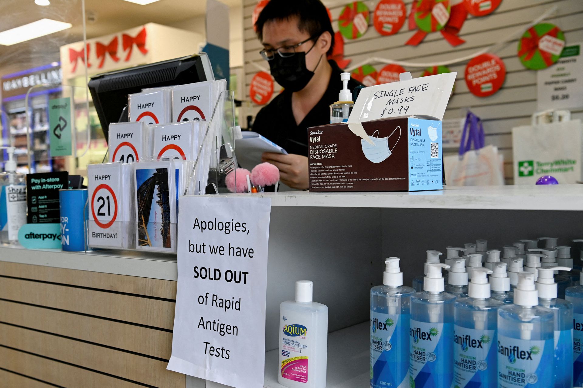 A pharmacy displays a sign to inform customers that Rapid Antigen Test kits are sold out in wake of the coronavirus disease in Sydney, Australia, Jan. 5, 2022.