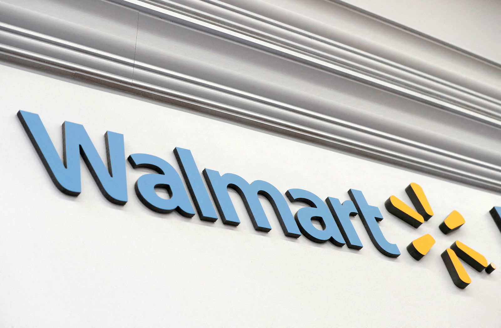 A Walmart sign is seen inside its department store in West Haven, Connecticut, Feb. 17, 2021.