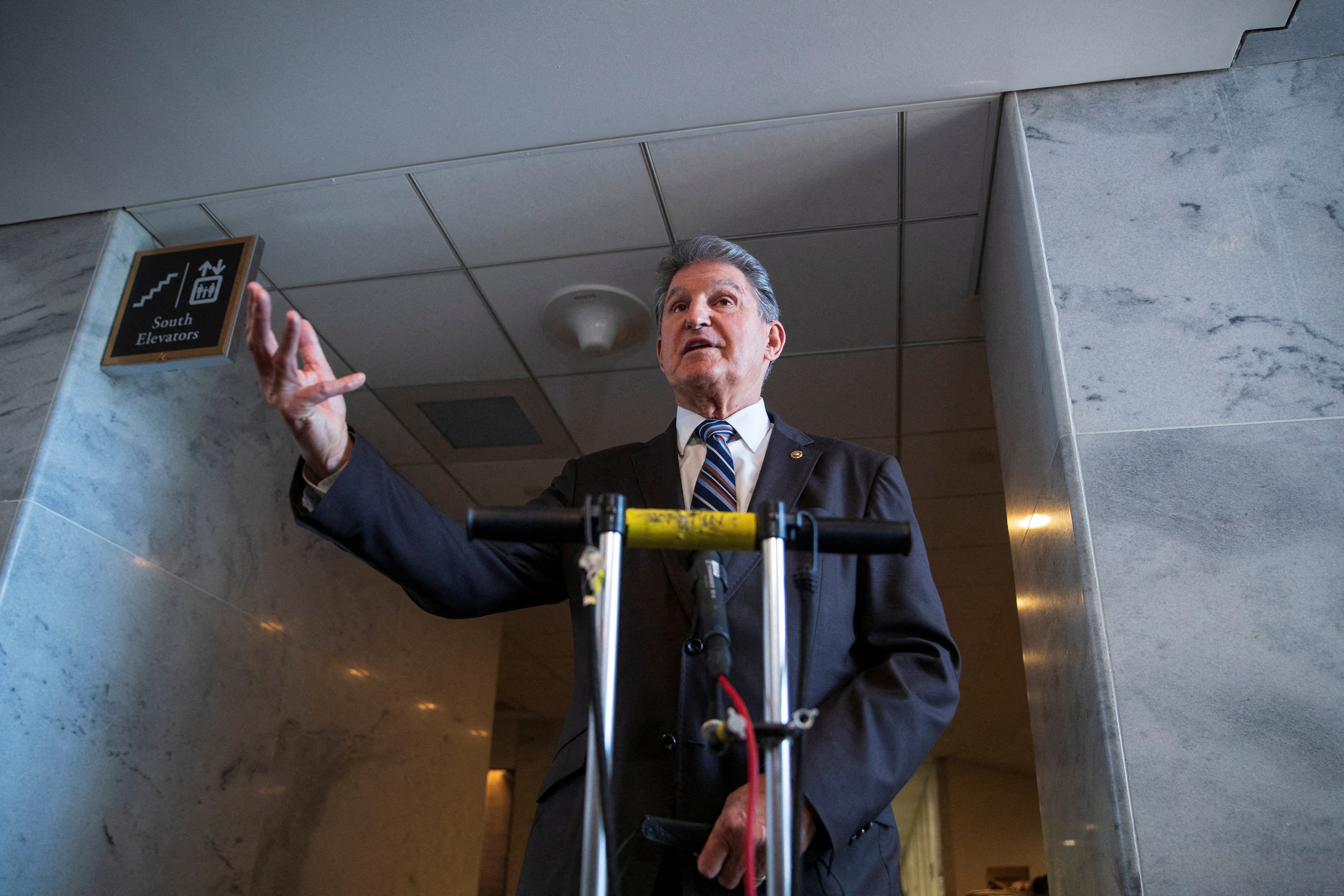 U.S. Sen. Joe Manchin, D-W.V., speaks to news reporters outside of his office in the Hart Senate Office Building on Capitol Hill in Washington, D.C., Jan. 4, 2022.