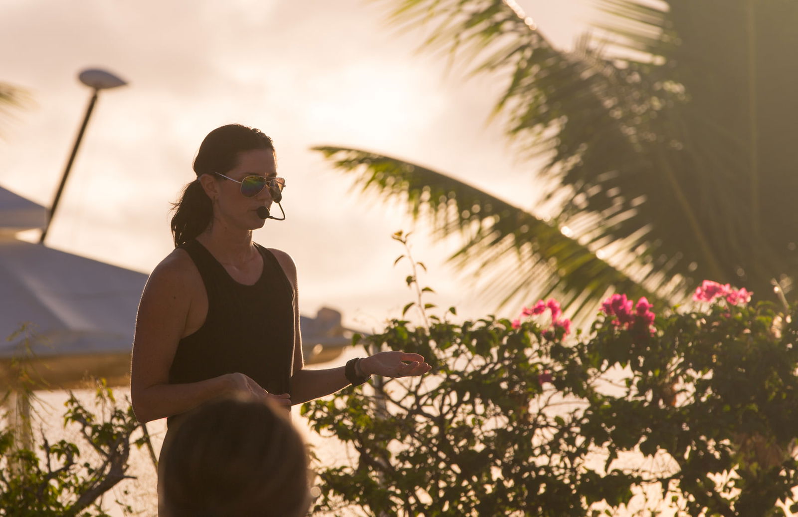 Yoga teacher Kerri Bauer briefs participants during sunset yoga at Aqua Resort Club.