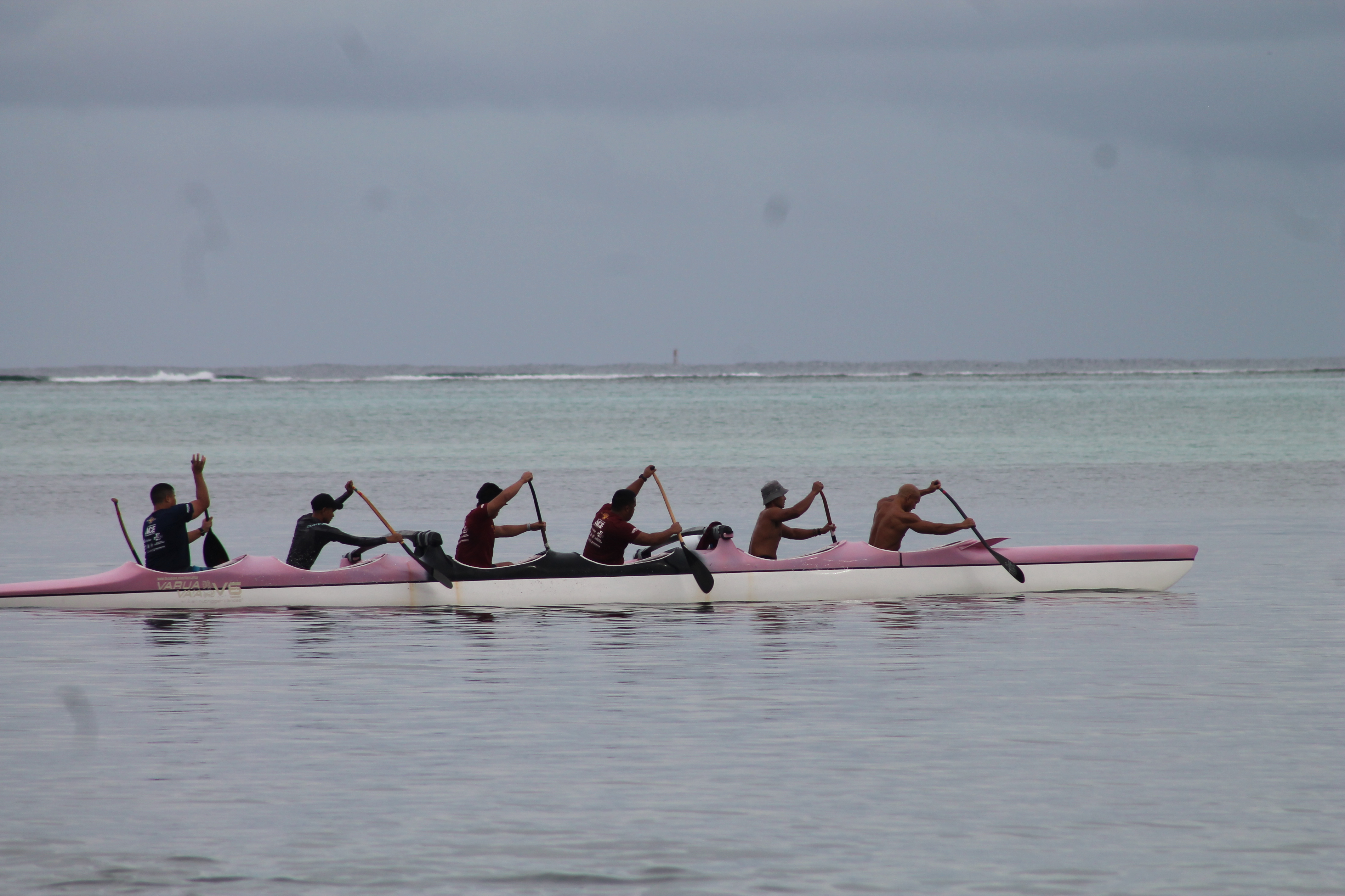 Paddlers conduct a training session on a V6 canoe in the Saipan lagoon in March 2021.