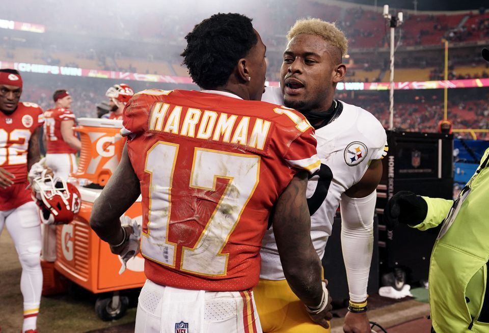 Kansas City Chiefs wide receiver Mecole Hardman (17) and Pittsburgh Steelers wide receiver JuJu Smith-Schuster, right, embrace following the AFC Wild Card playoff football game at GEHA Field at Arrowhead Stadium in Kansas City, Missouri on Jan. 16, 2022.