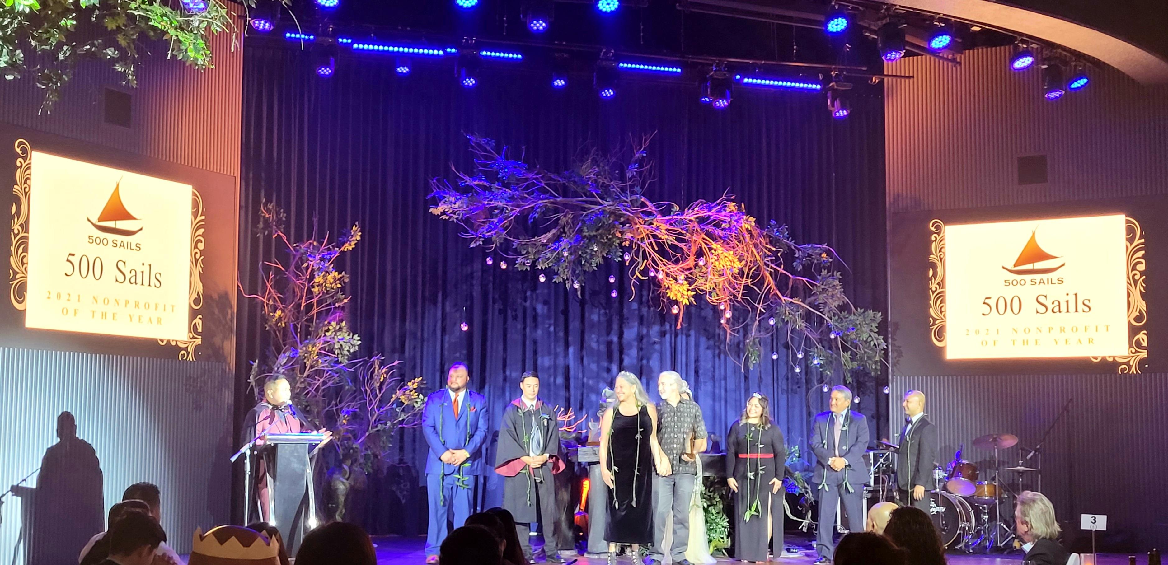 Emma and Pete Perez, center, of 500 Sails receive the Saipan Chamber of Commerce Nonprofit of the Year Award.