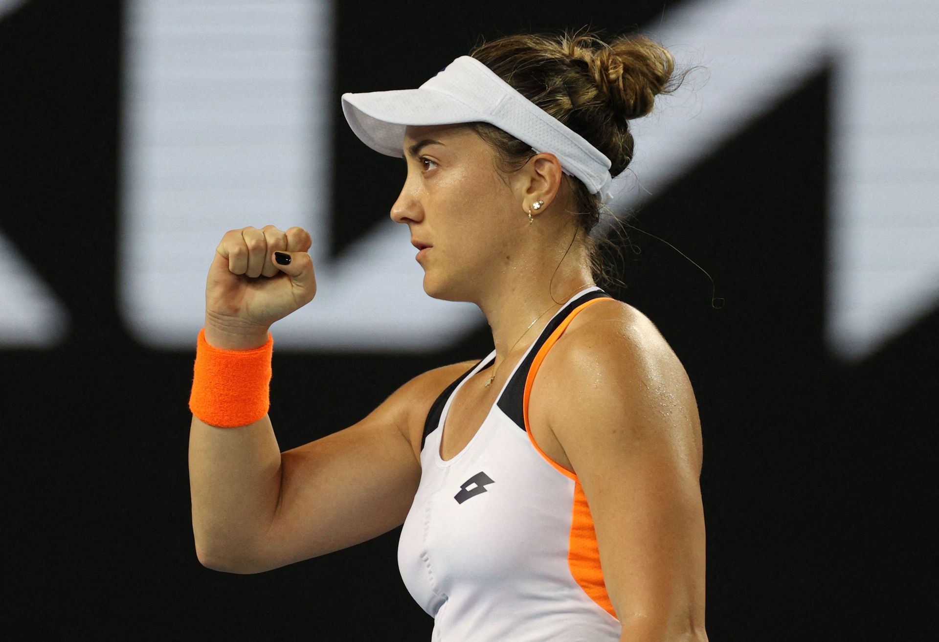 Montenegro's Danka Kovinic reacts during her second round match against Britain's Emma Raducanu in the Australian Open, Jan. 20, 2022.