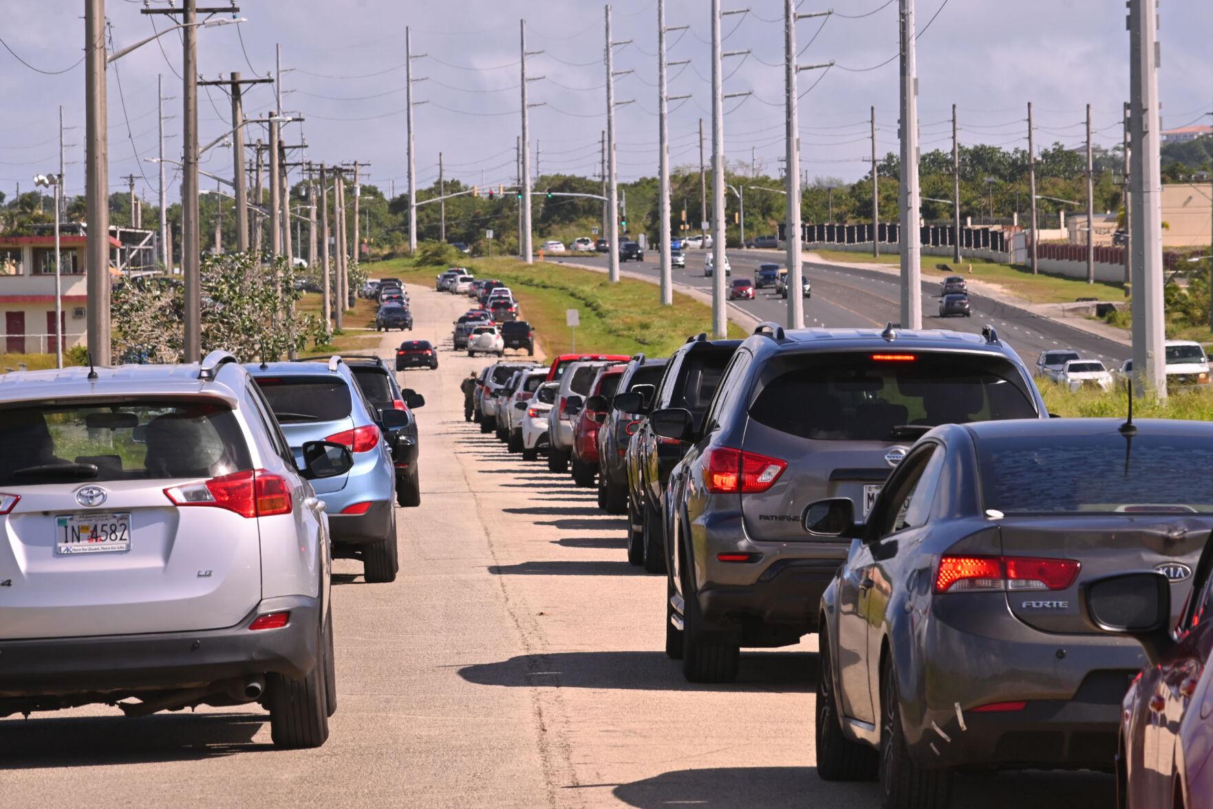 More than 100 motorists line up for Covid-19 testing at the Tiyan testing site Monday. According to a release from the Joint Information Center, a total of 309 new cases were identified from results released over the weekend.