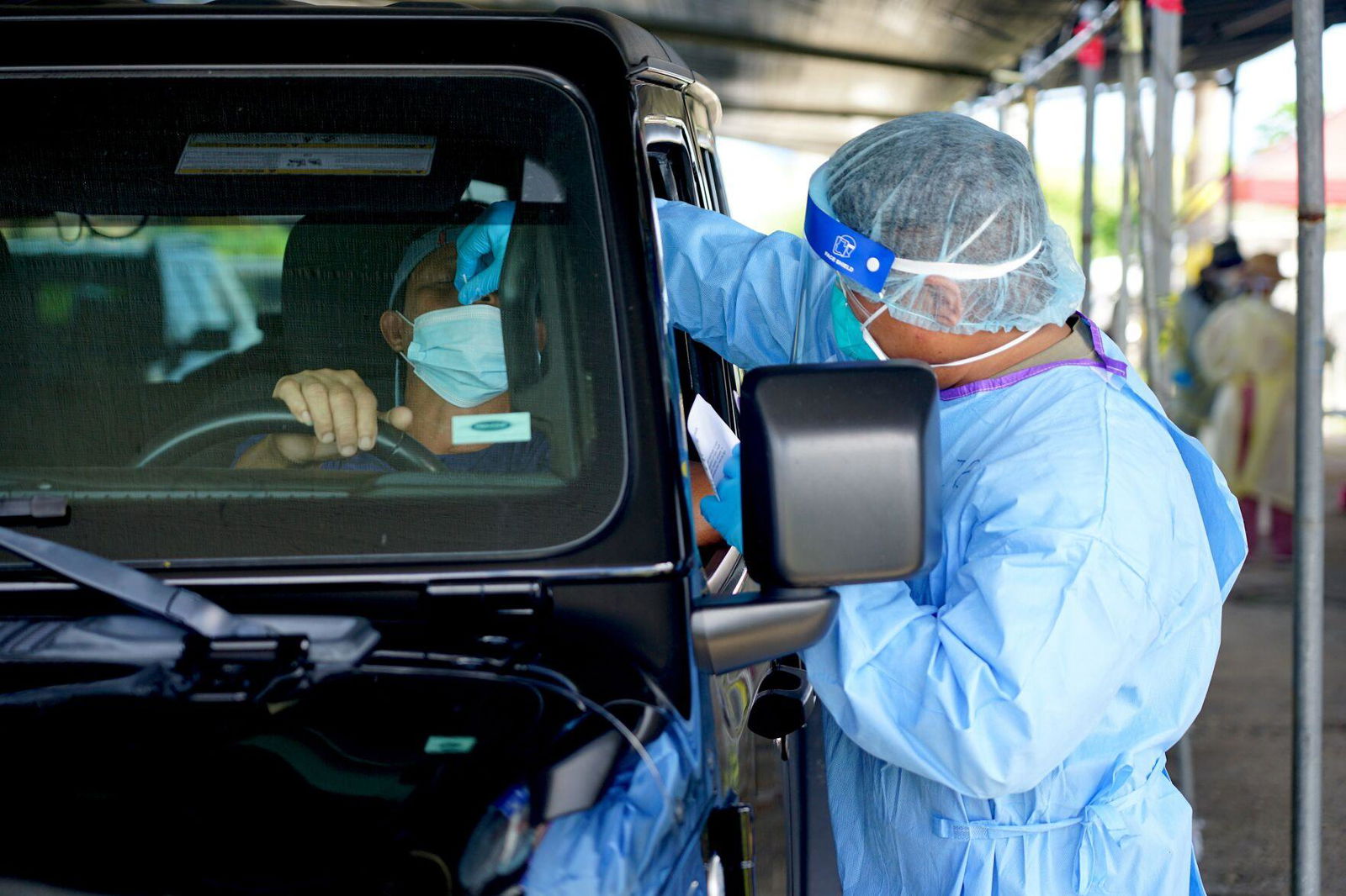 More island residents continue to get tested Thursday afternoon at the old carnival grounds in Tiyan, Guam.