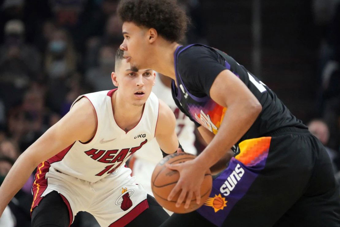 Miami Heat guard Tyler Herro (14) guards Phoenix Suns forward Cameron Johnson (23) during the second half at Footprint Center in Phoenix, Arizona on Jan. 8, 2022.