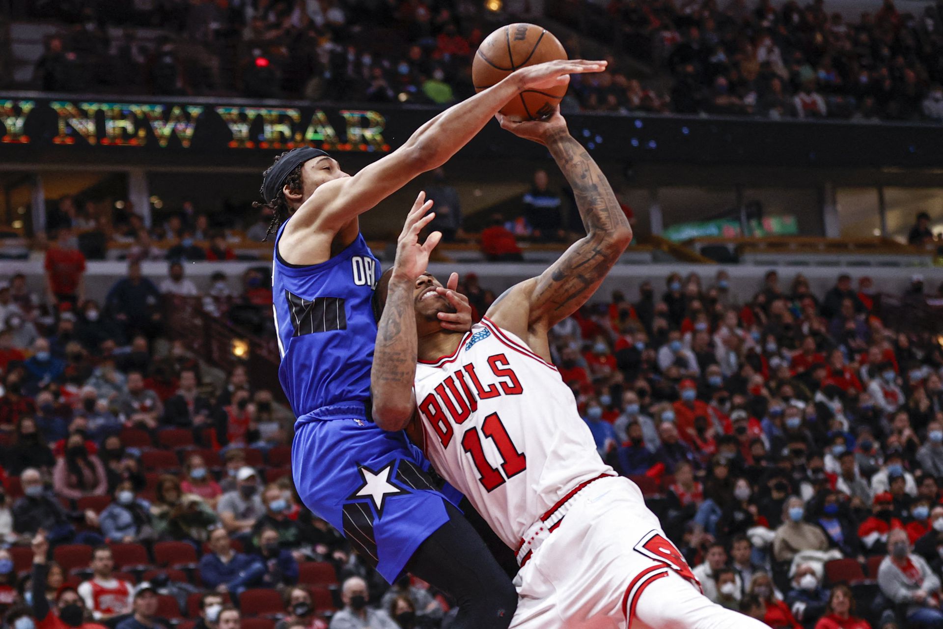 Orlando Magic guard R.J. Hampton (13) fouls Chicago Bulls forward DeMar DeRozan (11) during the second half at United Center in Chicago, Illinois on Jan. 3, 2022.