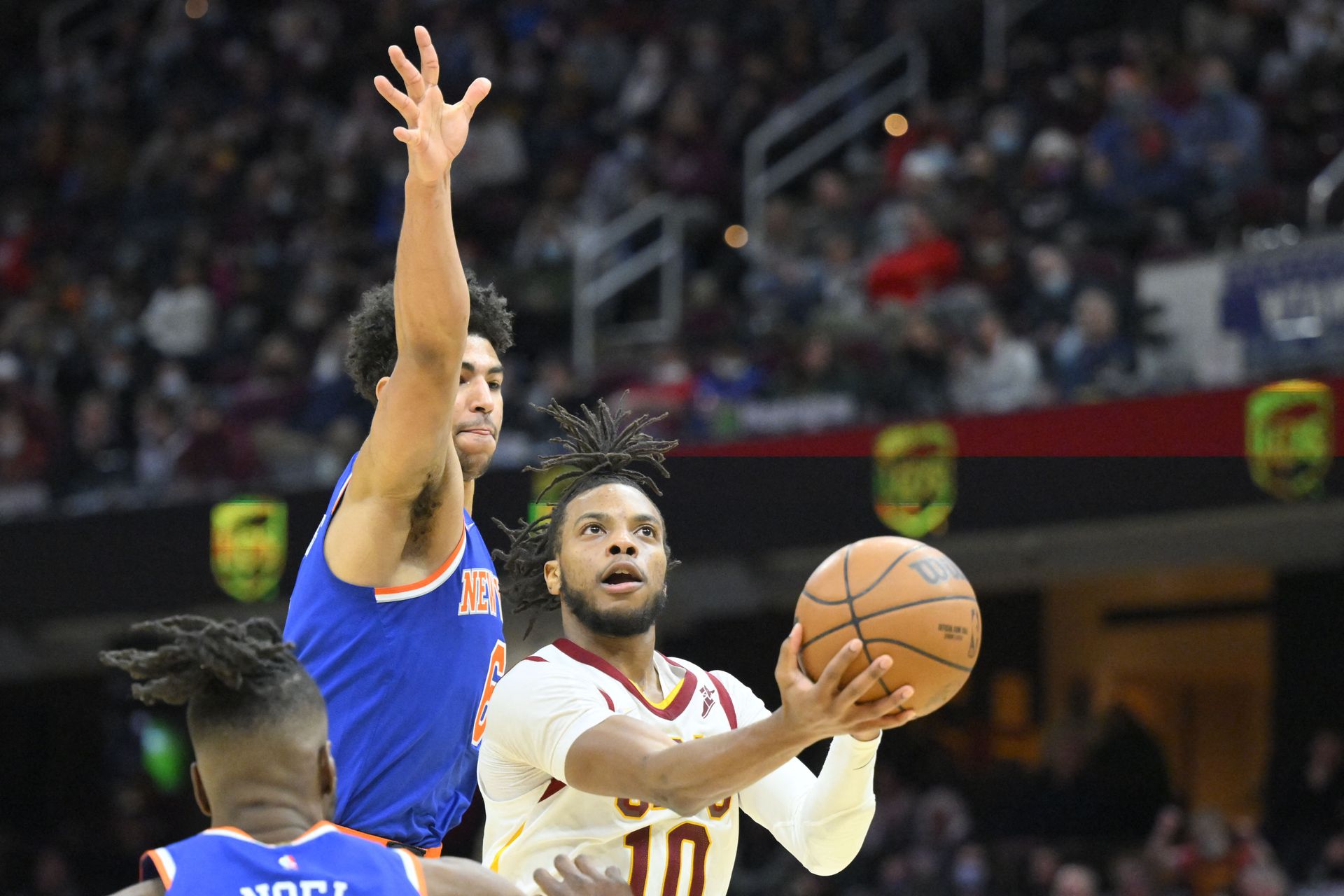 Cleveland Cavaliers guard Darius Garland (10) drives to the basket beside New York Knicks guard Quentin Grimes (6) in the fourth quarter at Rocket Mortgage FieldHouse in Cleveland, Ohio, Jan. 24, 2022.
