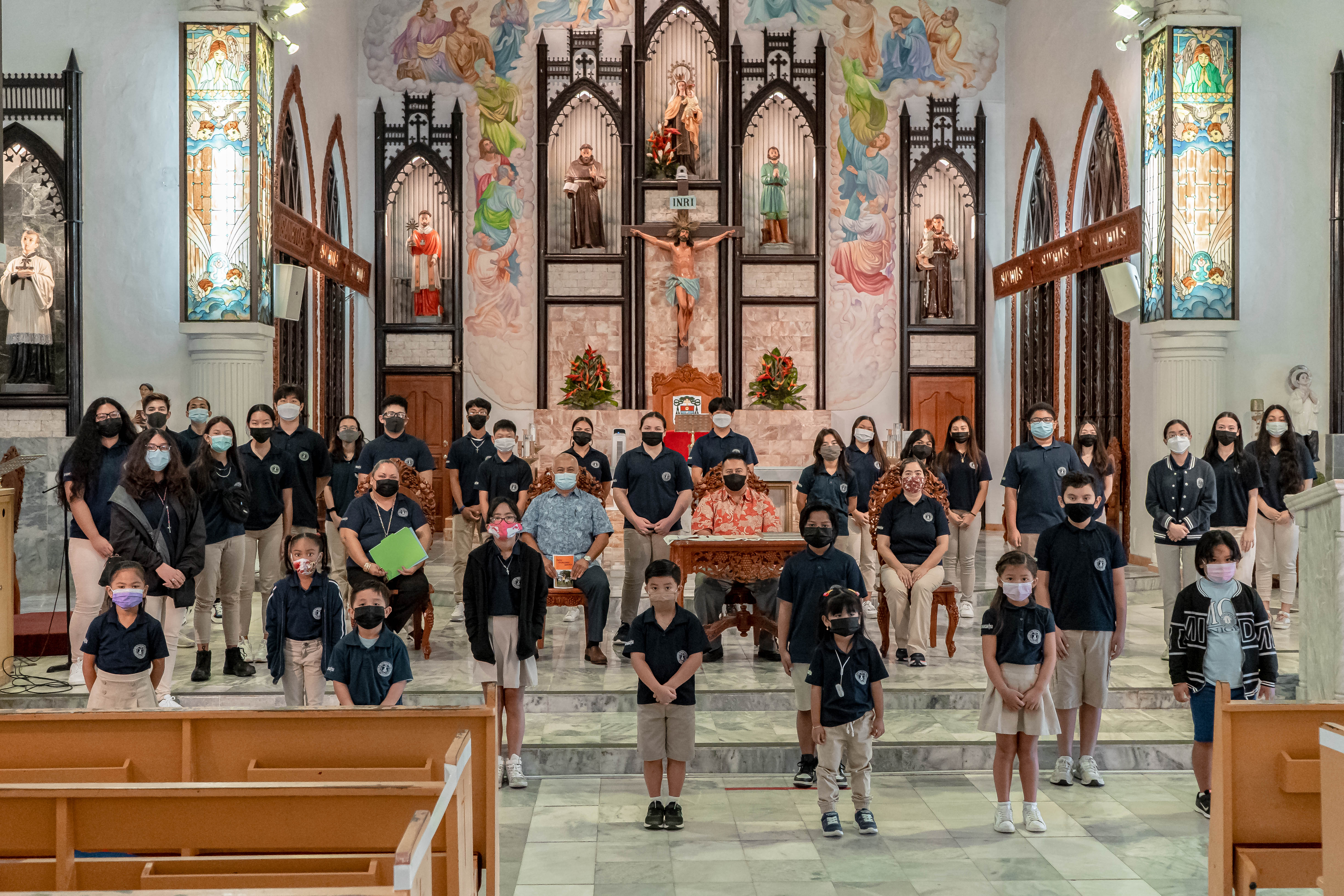 Gov. Ralph DLG Torres poses with a photo with Mount Carmel School acting President Frances Taimanao, MCS Vice Principal Filmah Buenaflor, MCS Board Chairman Vicente Babauta, and MCS students after signing a proclamation designating Jan. 30 – Feb. 5, 2022 as Catholic Schools Week at the Mount Carmel Cathedral on Wednesday.