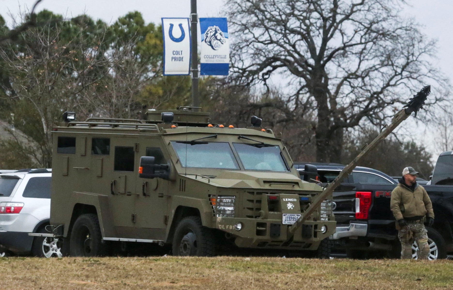 An armored law enforcement vehicle is seen in the area where a man has taken people hostage at a synagogue during services that were being streamed live, in Colleyville, Texas, Jan. 15, 2022.