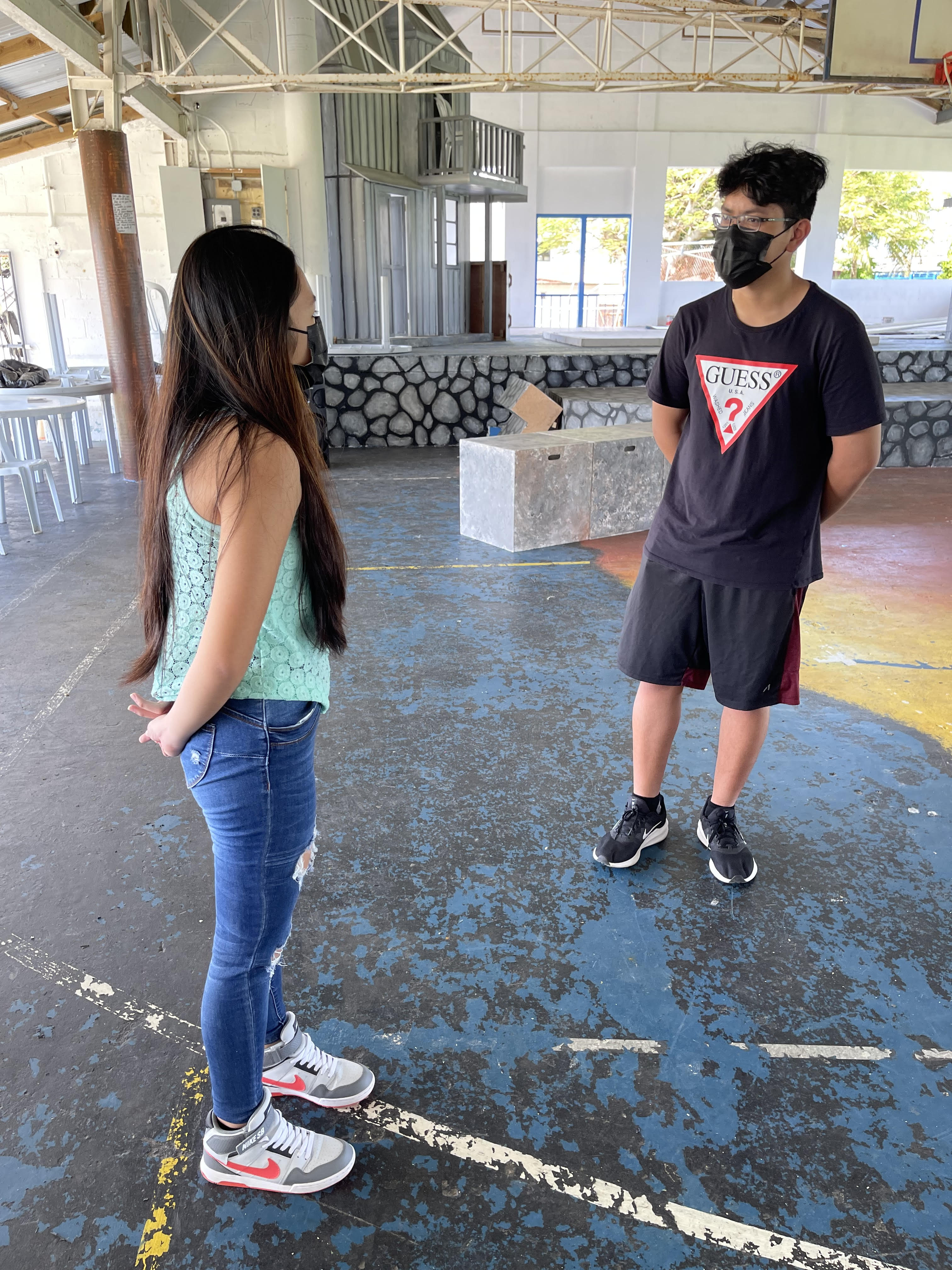Mount Carmel School sophomore Bernice Shane Sabino, left, and junior Manuel Pangelinan rehearse a scene from “The Sound of Music” as the two lead characters, Maria and Captain Georg von Trapp, respectively.