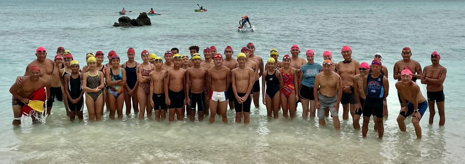 The participants of the Saipan Swim Club 3K race at Paupau Beach pose for a photo on Saturday.