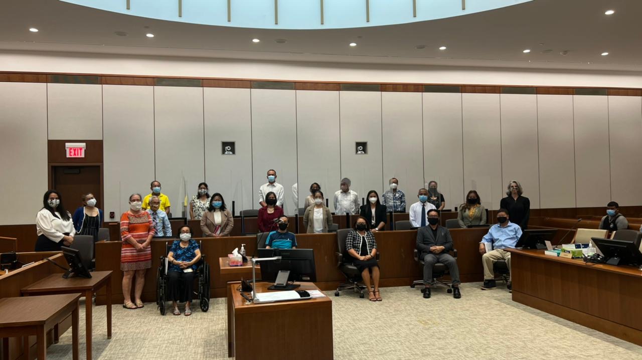 Twenty-one new U.S. citizens were sworn in  Tuesday morning. Also in  photo are Magistrate Judge Heather Kennedy of the District Court for the NMI, USCIS immigration officer Patricia Phelan, and District Court for the NMI law clerk Gretchen A. Smith.
