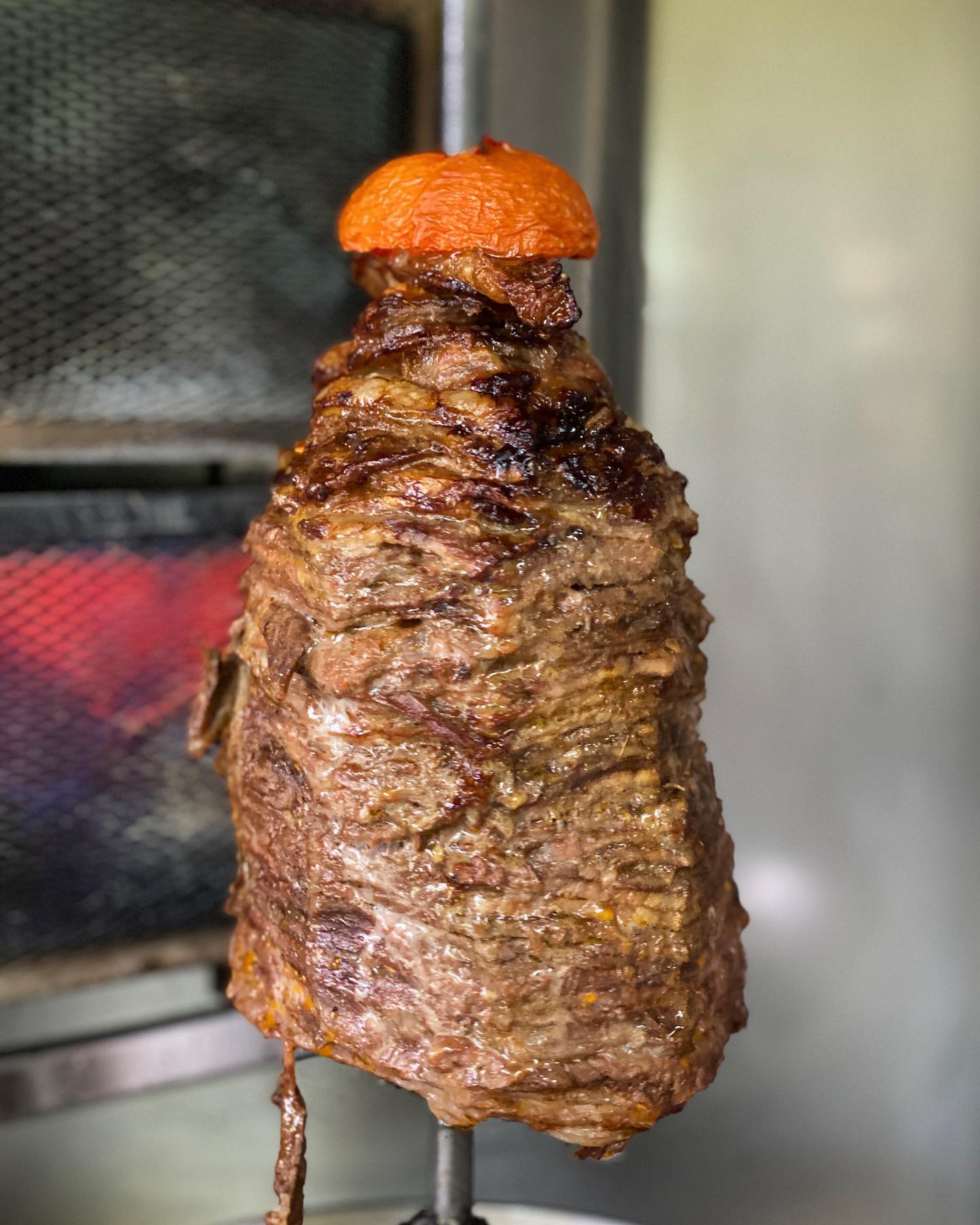 Traditional shawarma is well-marinated meat, layered on a vertical rotisserie or spit where it’s slow-roasted for hours/days — in its own juices and fat — until perfectly tender and extra flavorful!