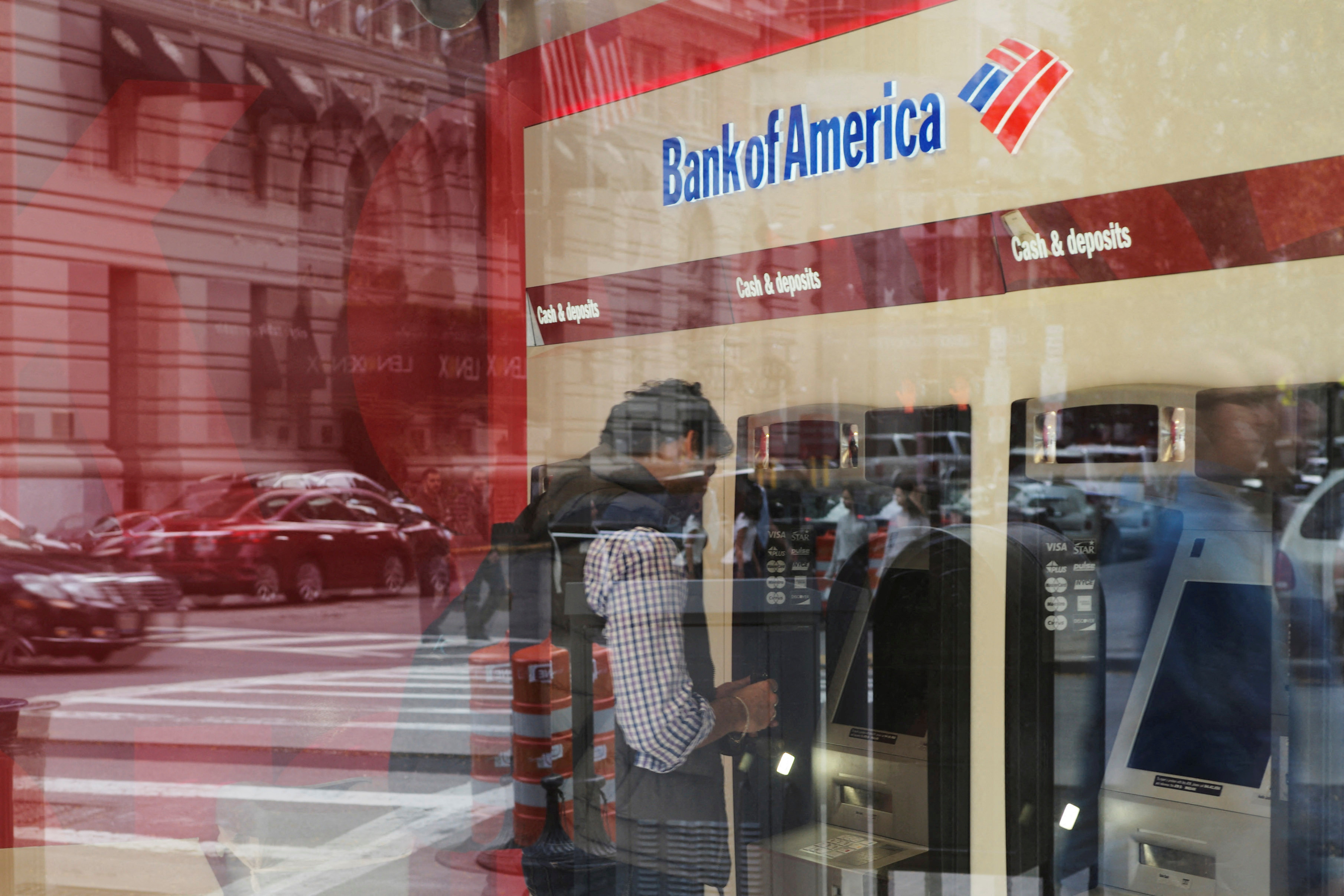 A customer uses an ATM at a Bank of America branch in Boston, Massachusetts, Oct. 11, 2017. 