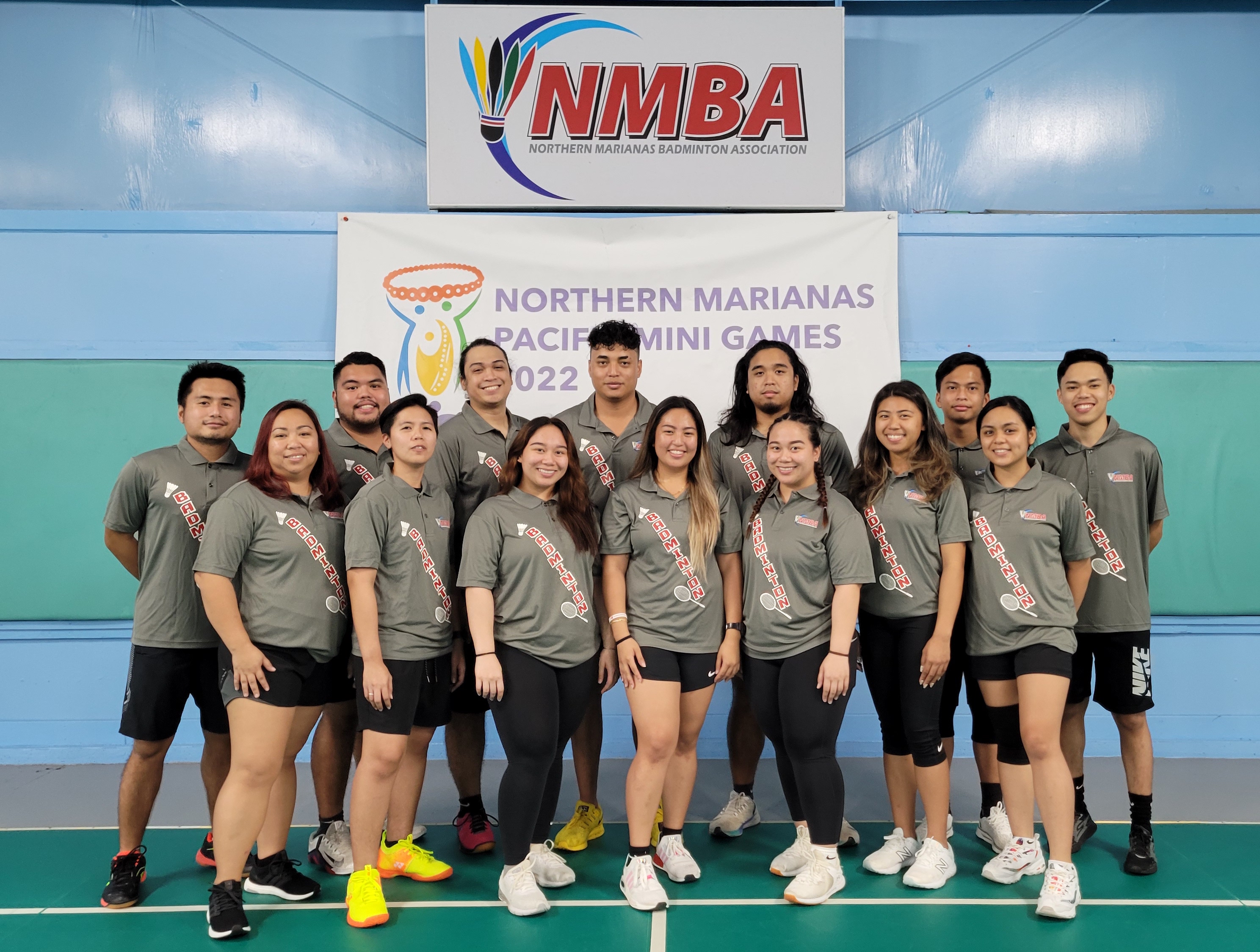 Members of the NMI National Badminton Team pose for a photo before starting their training session Wednesday at the TSL Sports Complex.