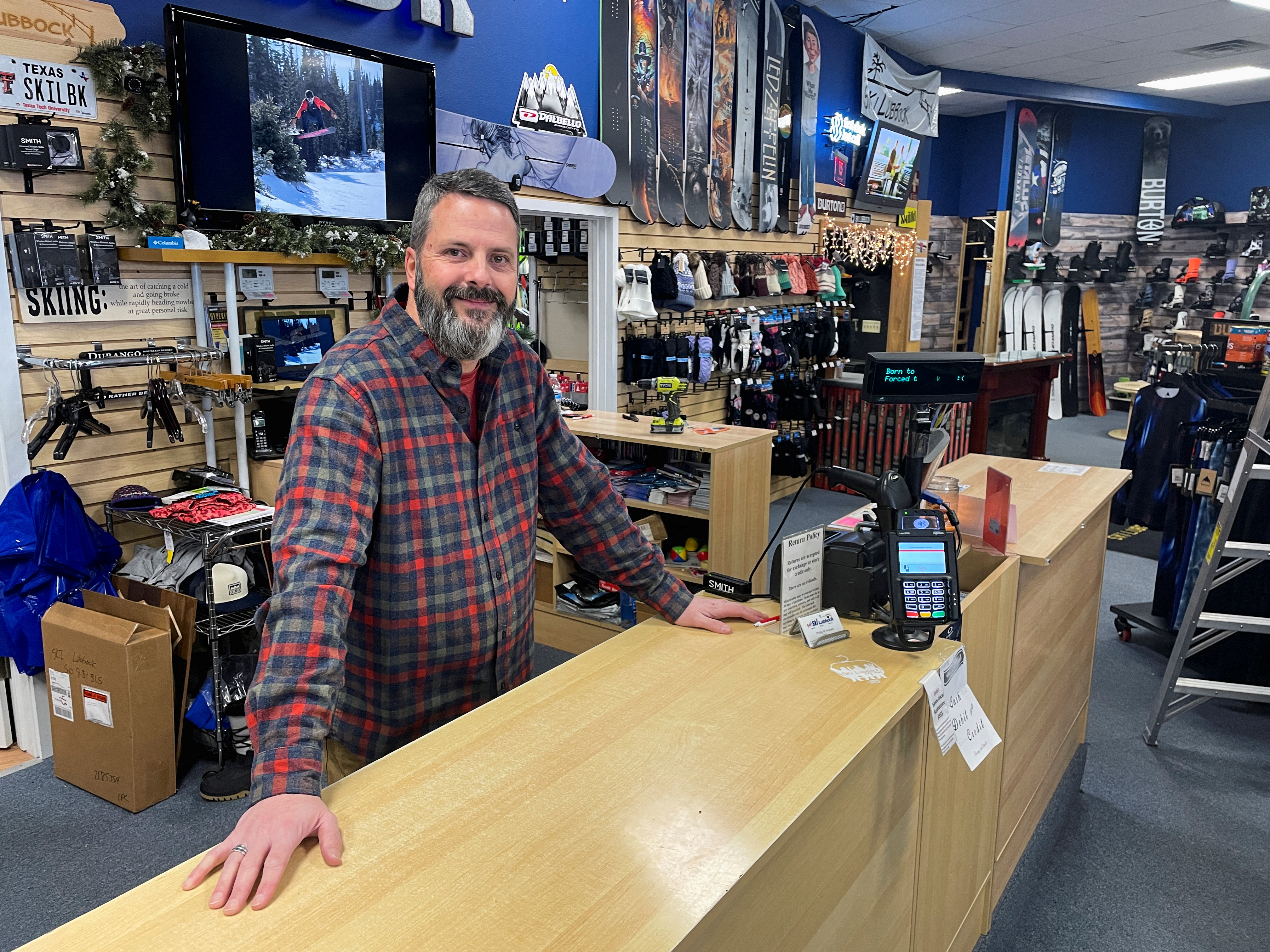 Phillip Howard poses for a photo inside his Troy's Ski Lubbock shop, in Lubbock, Texas, Jan. 14, 2022. 