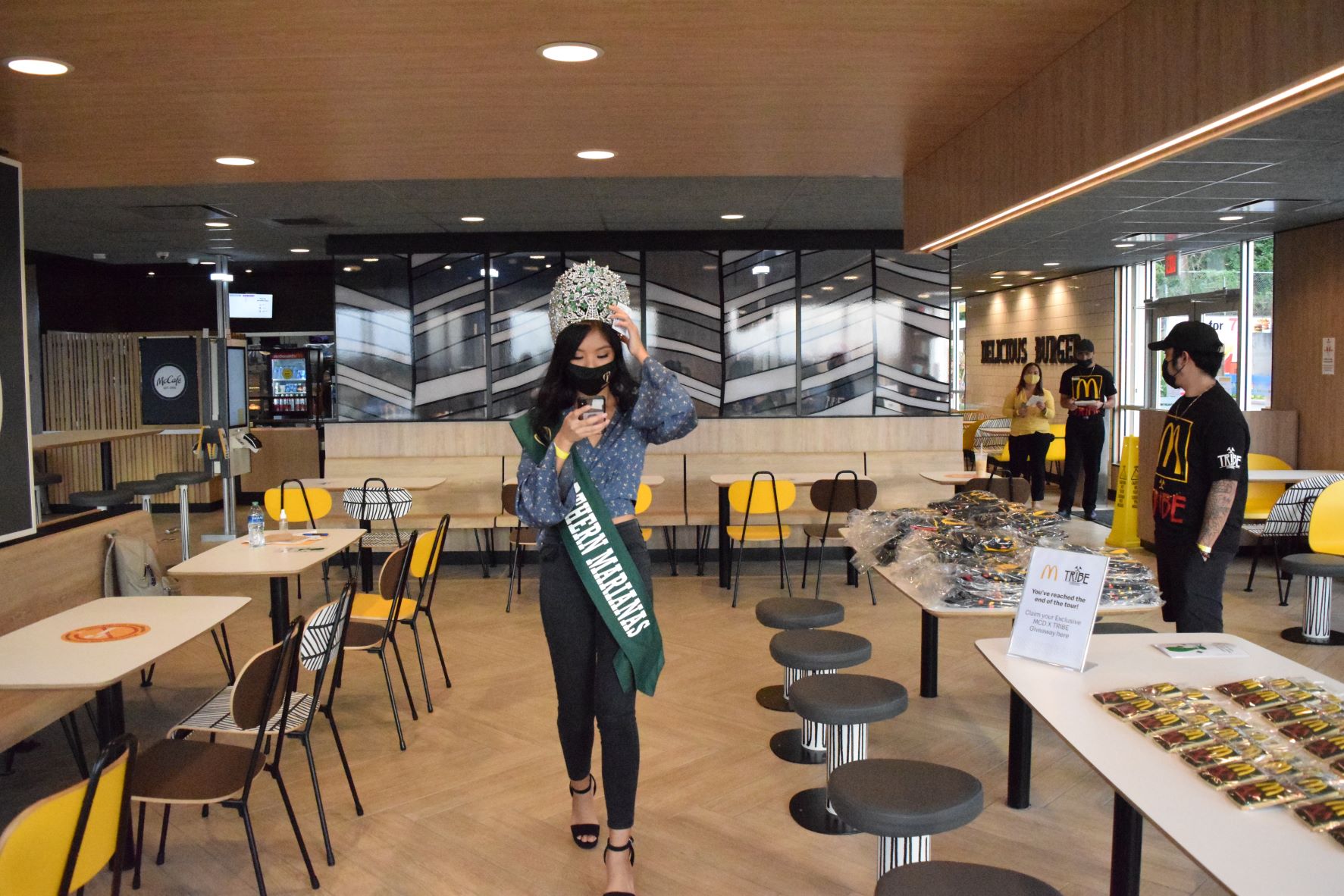 2021 Miss NMI Earth Crystal Fiona Rio checks her phone at the newly remodeled McDonald's restaurant on Middle Road.