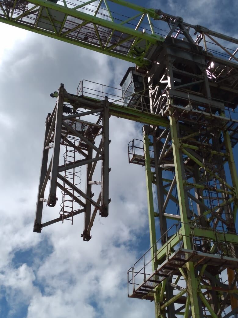 A section of tower crane No. 6 is being removed from the unfinished Imperial Pacific International  hotel-casino building on Thursday.